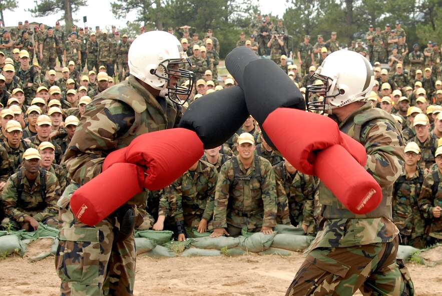 Academy basic cadet trainees Lawrance Franklin (left) and Griffin Biscone battle it out July 28 at the U.S. Air Force Academy, Colo., for the title of "Big Bad Basic," a single-elimination tournament where cadets battle one another with pugil sticks. Cadet Biscone went on to win the title in front of 1,200 of his peers. (U.S. Air Force photo/Mike Kaplan)