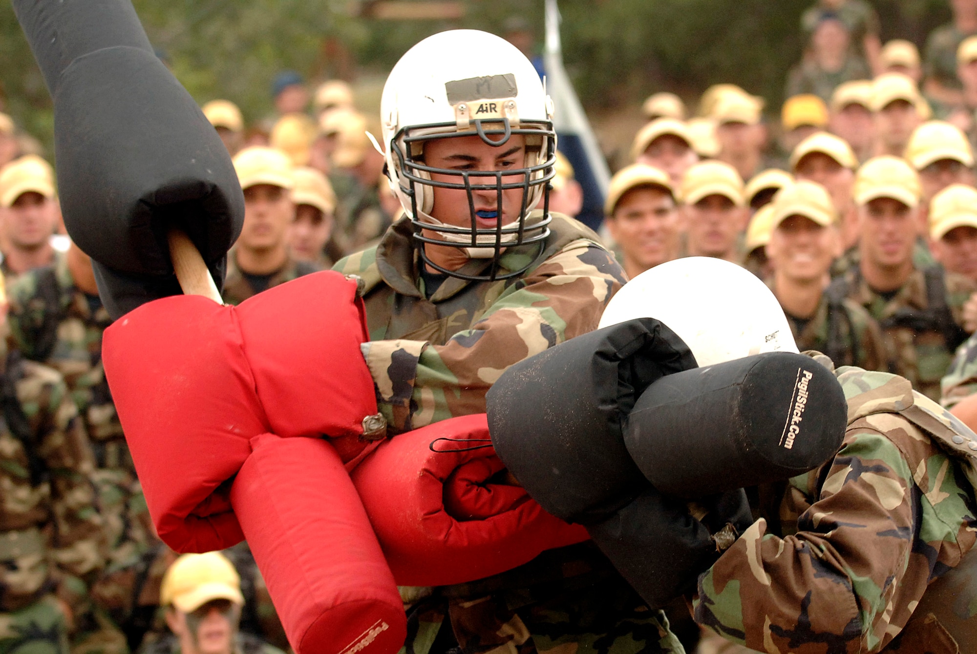 Academy basic cadet trainees Griffin Biscone (left) and Lawrance Franklin battle it out July 28 at the U.S. Air Force Academy, Colo., for the title of "Big Bad Basic," a single-elimination tournament where cadets battle one another with pugil sticks. Cadet Biscone went on to win the title in front of 1,200 of his peers. (U.S. Air Force photo/Mike Kaplan)