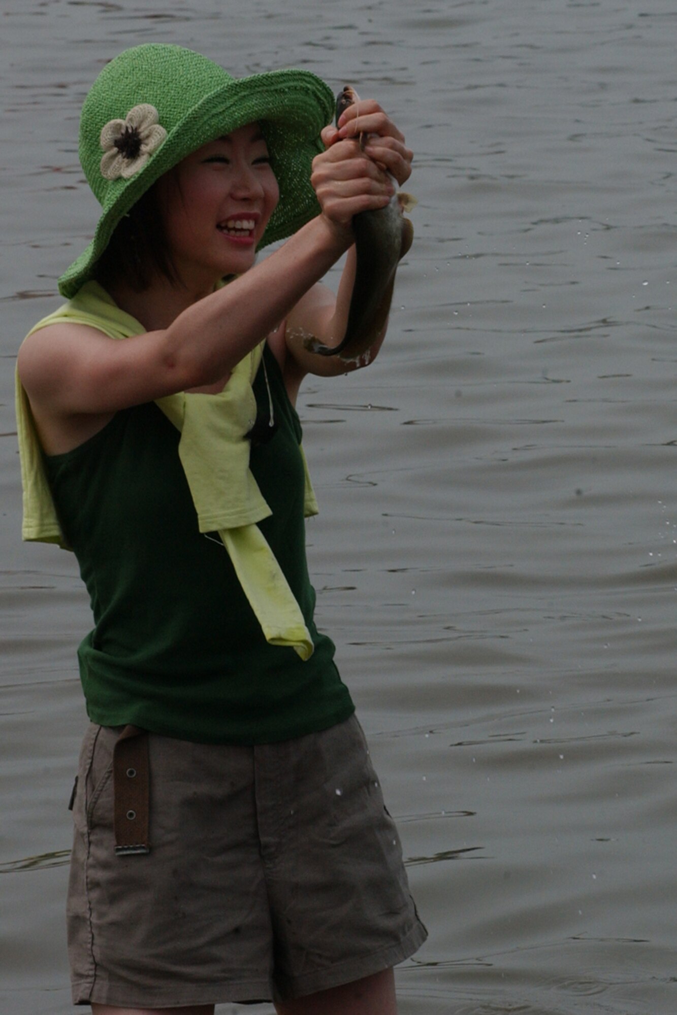 OSAN AIR BASE, Republic of Korea – Citizens of Pyongtaek and visitors take part in the 4th Annual “Catch Fishes by Hands” Festival.  The festival was held at the Jinwi River, near the city of Pyongtaek and Osan AB, on Aug. 3.  During the Catch Fishes by Hands Festival, Pyongtaek citizens and family members share traditional games, pottery making, fish sales, tug-of-war in the water, singing competitions and more.  The community also welcomed members from Team Osan to come and partake in the festival.   (U.S. Air Force photo by Staff Sgt. Christopher A. Marasky)