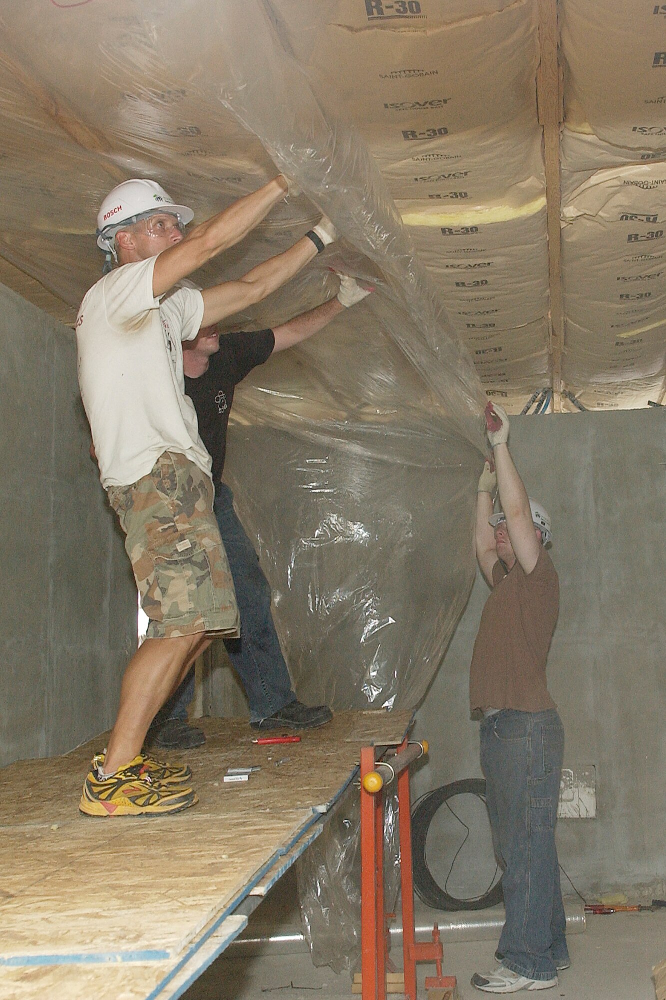 GUNSAN CITY, Republic of Korea -- Airmen from across the 8th Fighter Wing "Wolf Pack" at Kunsan Air Base work on the interior portion of a Habitat for Humanity home Aug. 1. Airmen from Kunsan Air Base and Korean university students worked together to all week building Habitat for Humanity homes for Gunsan City families. (U.S. Air Force photo/Senior Airman Giang Nguyen)

                               
                               
                               
                               
