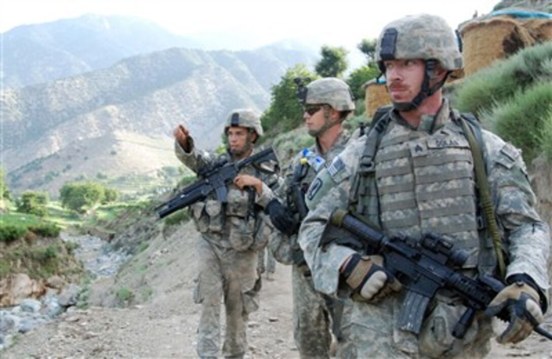 U.S. Army paratroopers from Red Platoon, Charlie Troop, 1st Squadron, 91st Cavalry Regiment (Airborne) navigate to Observation Post Chuck Norris in Dangam, Afghanistan on July 25, 2007, in Dangam, Afghanistan.  