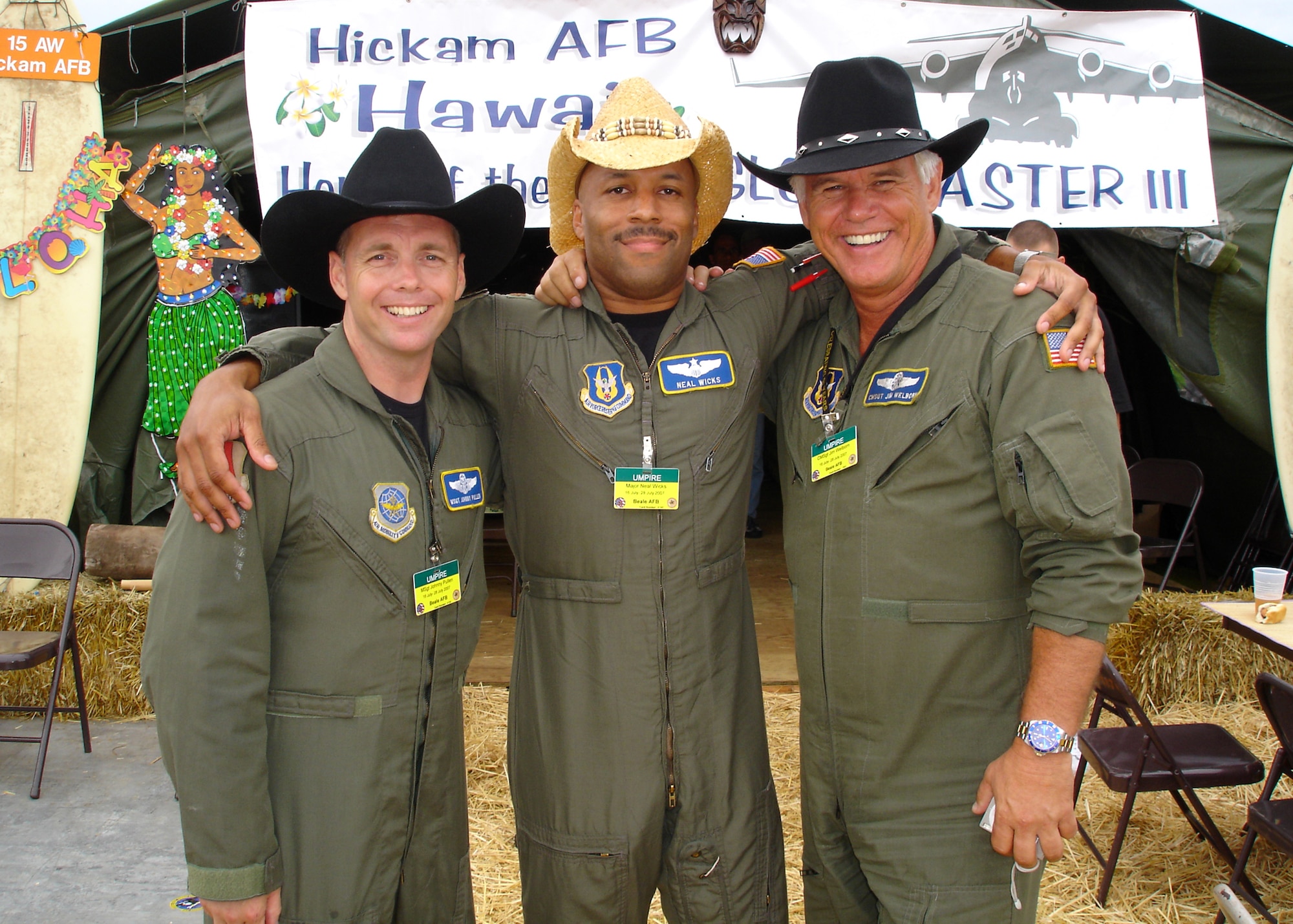 Air Force Reservists Technical Sgt. John E. Pullen, 314th Air Refueling Squadron boom operator, Maj. Neil Wicks, 314th ARS pilot, and Chief Master Sgt. Jim Welborn, 314th ARS boom operator, pose for a photo in front of the Hickam Air Force Base, Hawaii tent at "Rainer Ranch" July 23 during Air Mobility Rodeo 2007 at McChord AFB, Wash.  The Reservists, from the 940th Air Refueling Wing at Beale AFB, Calif., were part of a team at Rodeo to provide an opening ceremony KC-135 Stratotanker flyover and to help with the Aeromedical Evacuation portion of the competition.  Rodeo, hosted by Air Mobility Command, is a readiness competition of U.S. and international air mobility forces. It focuses on improving warfighting capabilities and support of the Global War on Terror. (U.S. Air Force photo/Stacey Knott)                              