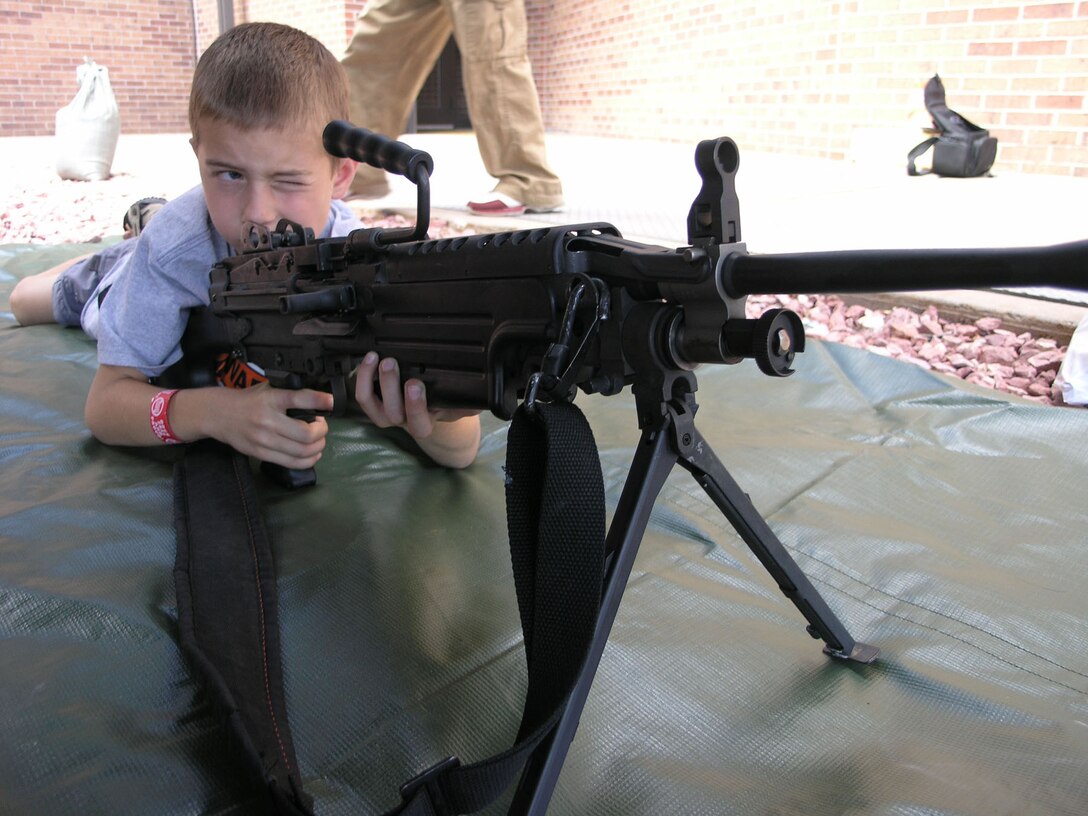 PETERSON AIR FORCE BASE, Colo. (AFRC) -- Jacob Blaskowsky, son of Tech. Sgt. Steve Blaskowsky, 302nd Maintenance Squadron flightline maintenance crew chief, prepares to put rounds on the target during the 302nd Airlfit Wing Family Day. (U.S. Air Force photo/Tech. Sgt. David D. Morton)