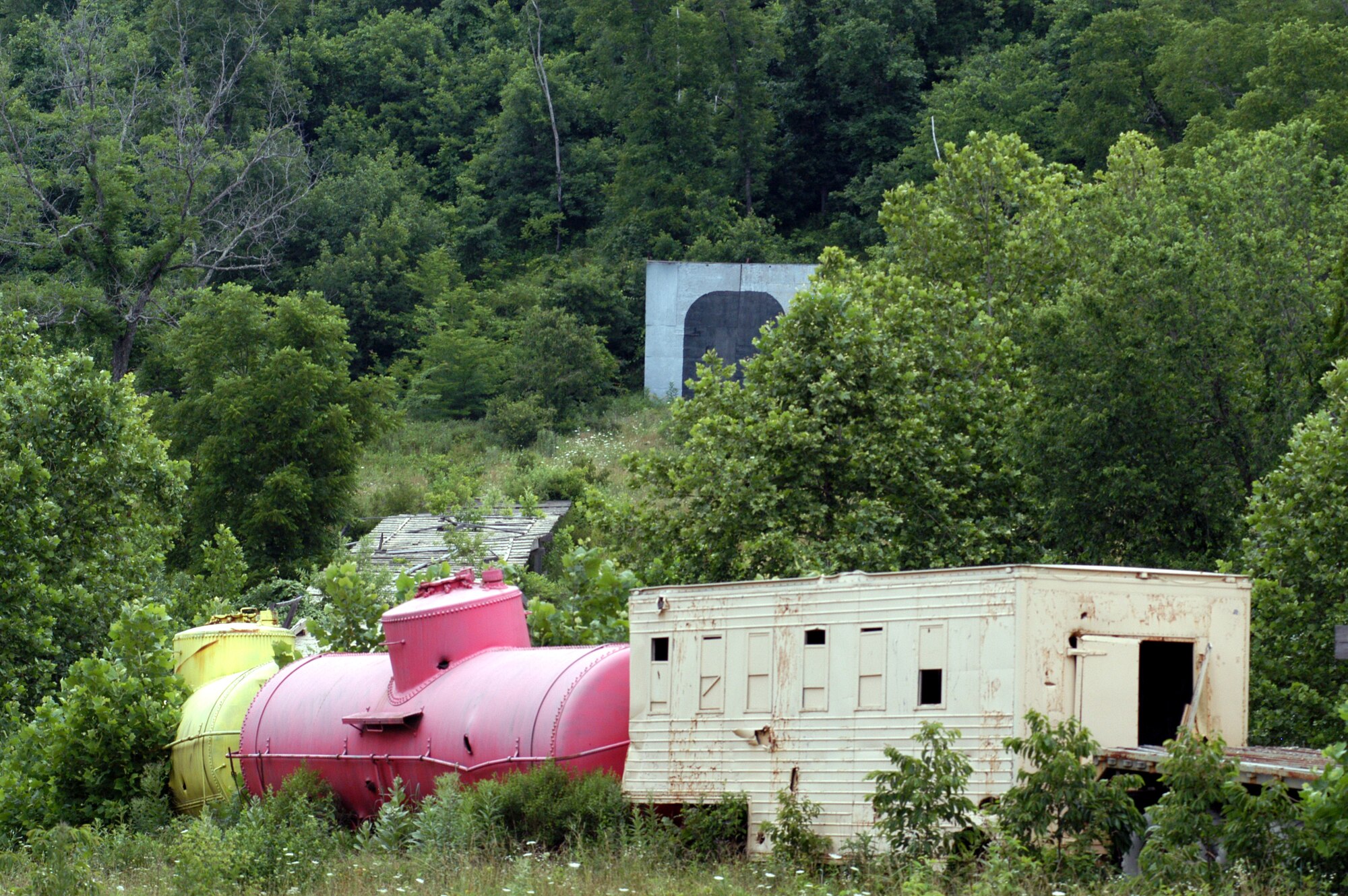 The Missouri Air National Guard members who manage and operate Cannon Range, near Fort Leonard Wood, Mo., find creative ways to build targets out of old vehicles, weapons and scrap.  In this target, they constructed a "train" complete with "tunnels" into surrounding hillsides for pilots to practice ground-attack skills.  (U.S. Air Force photo/Maj. David Kurle) 