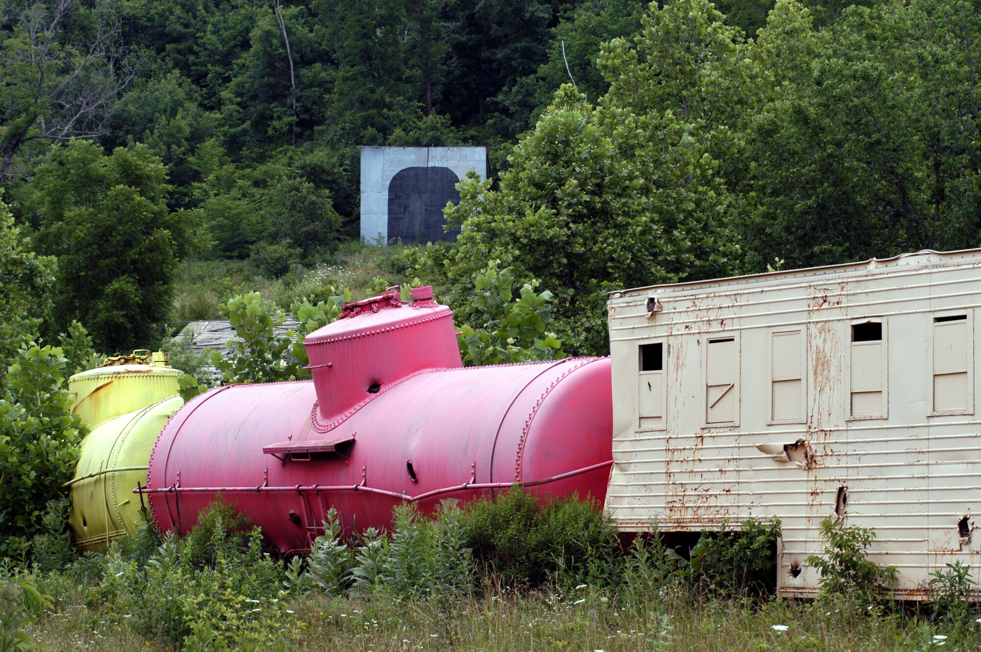 The Missouri Air National Guard members who manage and operate Cannon Range, near Fort Leonard Wood, Mo., find creative ways to build targets out of old vehicles, weapons and scrap.  In this target, they constructed a "train" complete with "tunnels" into surrounding hillsides for pilots to practice ground-attack skills.  (U.S. Air Force photo/Maj. David Kurle) 