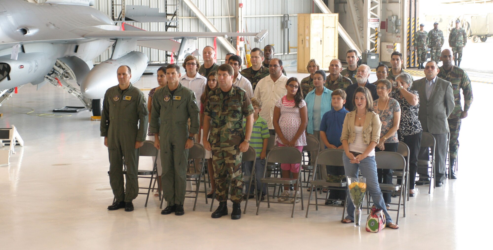 Family and friends of Lt. Cols June Groff and Luis Millares joined, (front row from left), 482nd Fighter Wing Commander Col. Randy Falcon, Vice Commander Col. Robert Polumbo and Special Assistant to the Commander Col. Dennis Daley for a maintenance group promotion and assumption of command ceremony here Aug. 5.
Colonel Groff assumed command of the 482nd Fighter Wing Maintenance Squadron and Luis Milares was both promoted to lieutenant colonel and assumed command of the 482nd Fighter Wing Aircraft Maintenance Squadron.
Air Force photo/Tech. Sgt. Paul Dean 
