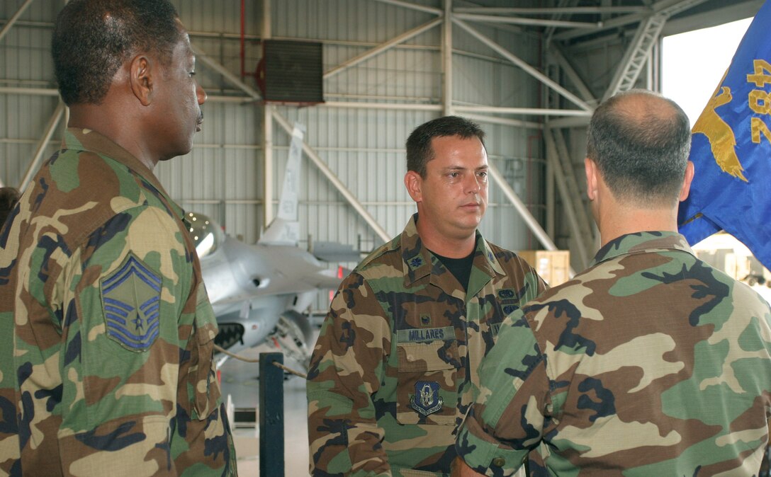 Lt. Col. Luis Millares accepted command of the 482nd Fighter Wing Aircraft Maintenance Squadron in a ceremony here Aug. 5.
The guidon was passed from 482nd Fighter Wing Maintenance Group Commander Col. T. Glenn Davis to Colonel Millares through Senior Master Sgt. Laurence Smith, acting first sergeant of the 482nd FW AMXS.
Colonel Millares noted the number of changes in his life during the past year: two prior military commands and a change in his civilian career preceded his assumption of command of the AMXS. He thanked Colonel Davis for the opportunity to lead the maintenance squadron, mentoring from the group commander and offered maintenance Airmen a glimpse of the future: to build on strengths and accomplishments while working toward greater cohesiveness among all group units. 
U.S. Air Force photo/Tech. Sgt. Paul Dean
