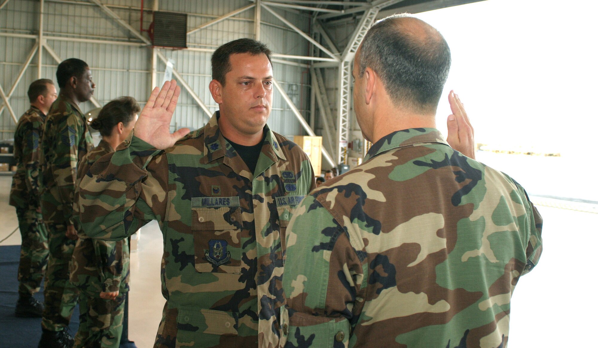 482nd fighter Wing Maintenance Group Commander Col. T. Glenn Davis administers the Oath of Office to newly promoted Lt. Col. Luis Millares during a ceremony Aug. 5. Colonel Millares also accepted command of the 482nd Fighter Wing Aircraft Maintenance Squadron during the ceremony.
Colonel Millares told members of the maintenance squadron that he looks forward to improving maintenance group cohesiveness. He thanked family and friends for their support throughout his military career.
U.S. Air Force photo/Tech. Sgt. Paul Dean
