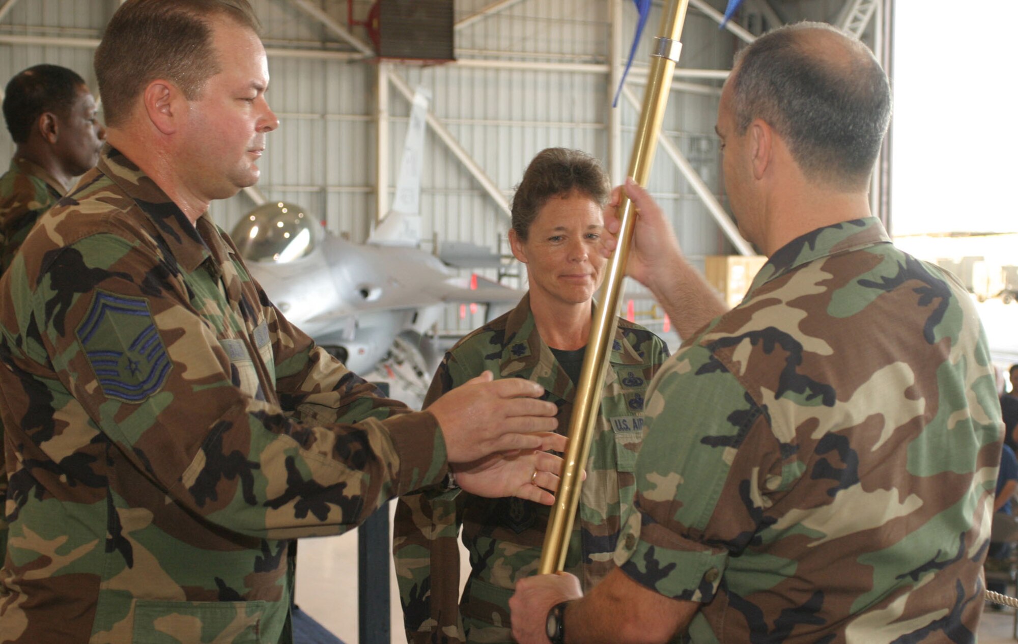 Lt. Col. June Groff accepted command of the 482nd Fighter Wing Maintenance Squadron in a ceremony here Aug. 5. The unit guidon is passing from 482nd Fighter Wing Maintenance Group Commander Col. T. Glenn Davis to Senior Master Sgt. J. David Bailey, 482nd Fighter Wing Maintenance Squadron Acting First Sergeant prior to handoff to Colonel Groff.
Colonel Groff thanked family members and Airmen mentors for helping her throughout her Air Force career, which began in 1982 as an enlisted computer operator.
Air Force photo/Tech. Sgt. Paul Dean 
