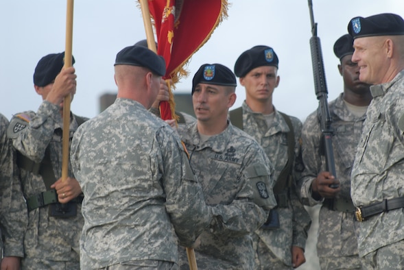Army Lt. Col. Edward O'Neill passes the unit flag to Command Sgt. Maj. Michael Kuppers after assuming command of the 1-1 Air Defense Artillery Battalion at Kadena Air Base, Japan, Aug. 7, 2007.  The unit activated at the base in November 2006, conducts missile defense for the region with the Patriot missile system in accordance with the U.S. and Japan bilateral security agreements.  U.S. Air Force photo/Senior Airman Darnell Cannady