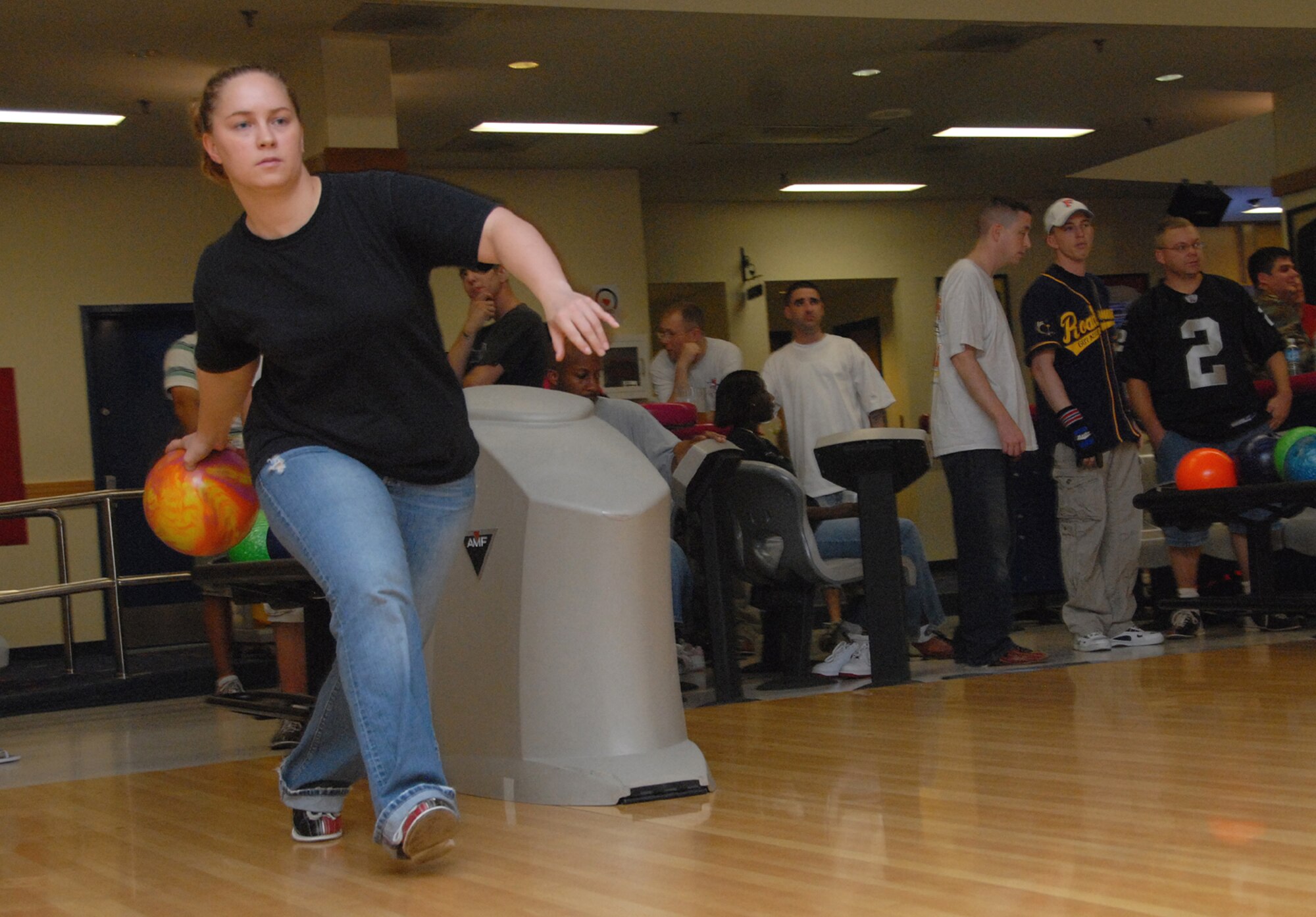OSAN AIRBASE, Republic of Korea --  Senior Airman Melissa Niffen, 51st Comptroller Squadron, practices for a game at the Air Force Ball committee sponsored “Bowl-a-Thon” at the base bowling center Aug. 3. The Bowl-a-Thon raised money for the Air Force Ball, which will be held at the Osan Officers’ Club on Sept. 21. The next event the committee is sponsoring is an F-16/A-10 pull on Sept. 7. ( U.S. Air Force photo by Senior Airman Eunique Stevens)
