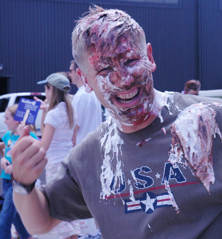 PETERSON AIR FORCE BASE, Colo. -- It's not blush, it's cherry pie adorning the facial features of Maj. Alan Flolo, 302nd Airlift Wing executive officer. People donated money to have 11 wing members receive a pie in the face during 302nd AW Family Day Aug. 4. (U.S. Air Force photo/1st Lt. Jody Ritchie)