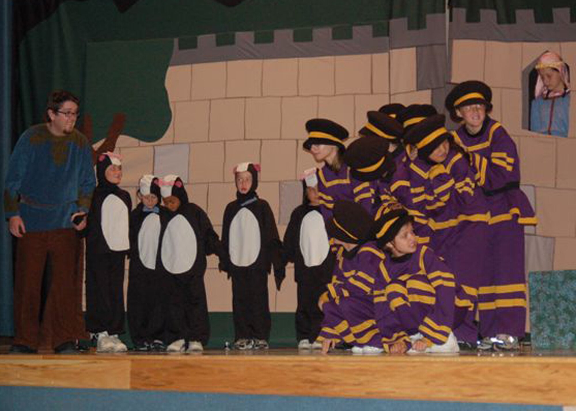 EIELSON AIR FORCE BASE, Alaska--With Maid Marian locked high in the tower, and Prince John's men waiting in ambush, skunks of Robin Hood's merry band try to figure out how to rescue her July 27 at the base theater.  In the end, they help Robin Hood by distracting the guards.  Annually, the Missoula Children's Theater staff visits Air Force bases in the world with sets and props to allow children to become the stars.  (U.S. Air Force photo by Misty Campbell)