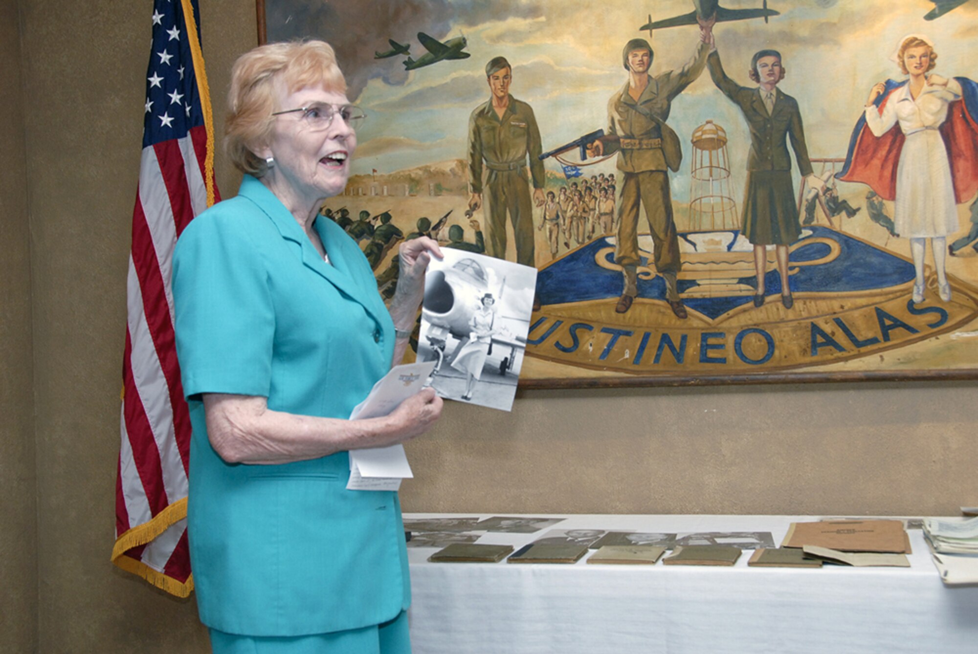 Mrs. Mary Hall, former wife of Col. William H. Davidson, displays some of the artifacts she donated to the base heritage center Aug. 3. (U.S. Air Force photo/Sandy Wassenmiller)