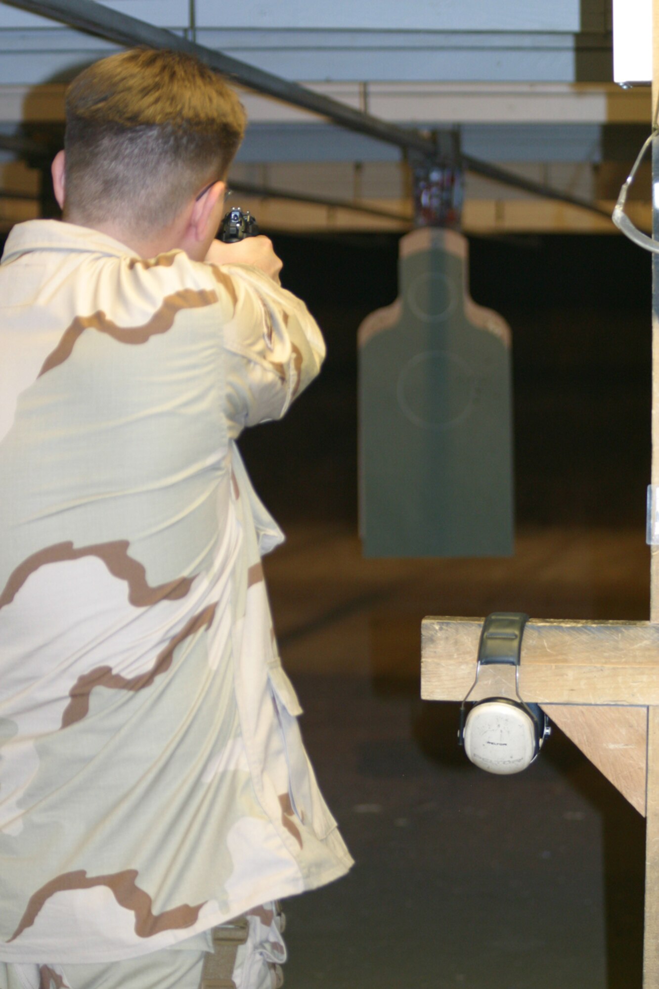 A member of the 419th Security Forces Squadron qualifies on a 9-mm weapon in preparation for deployment to Kirkuk, Iraq in support of OIF. (U.S. Air Force photo/SSgt. Christina Wright)