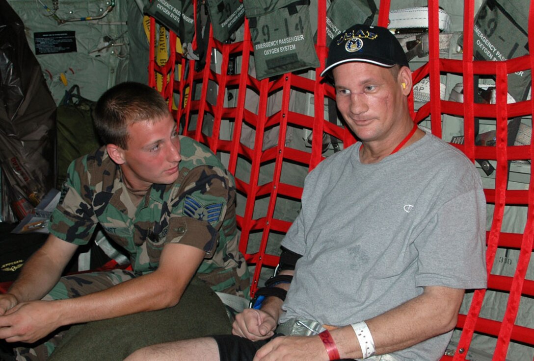 TSgt Tim Juliano talks to another Purple Heart recipient SSgt Kyle Ernst, also from the 914th LRS