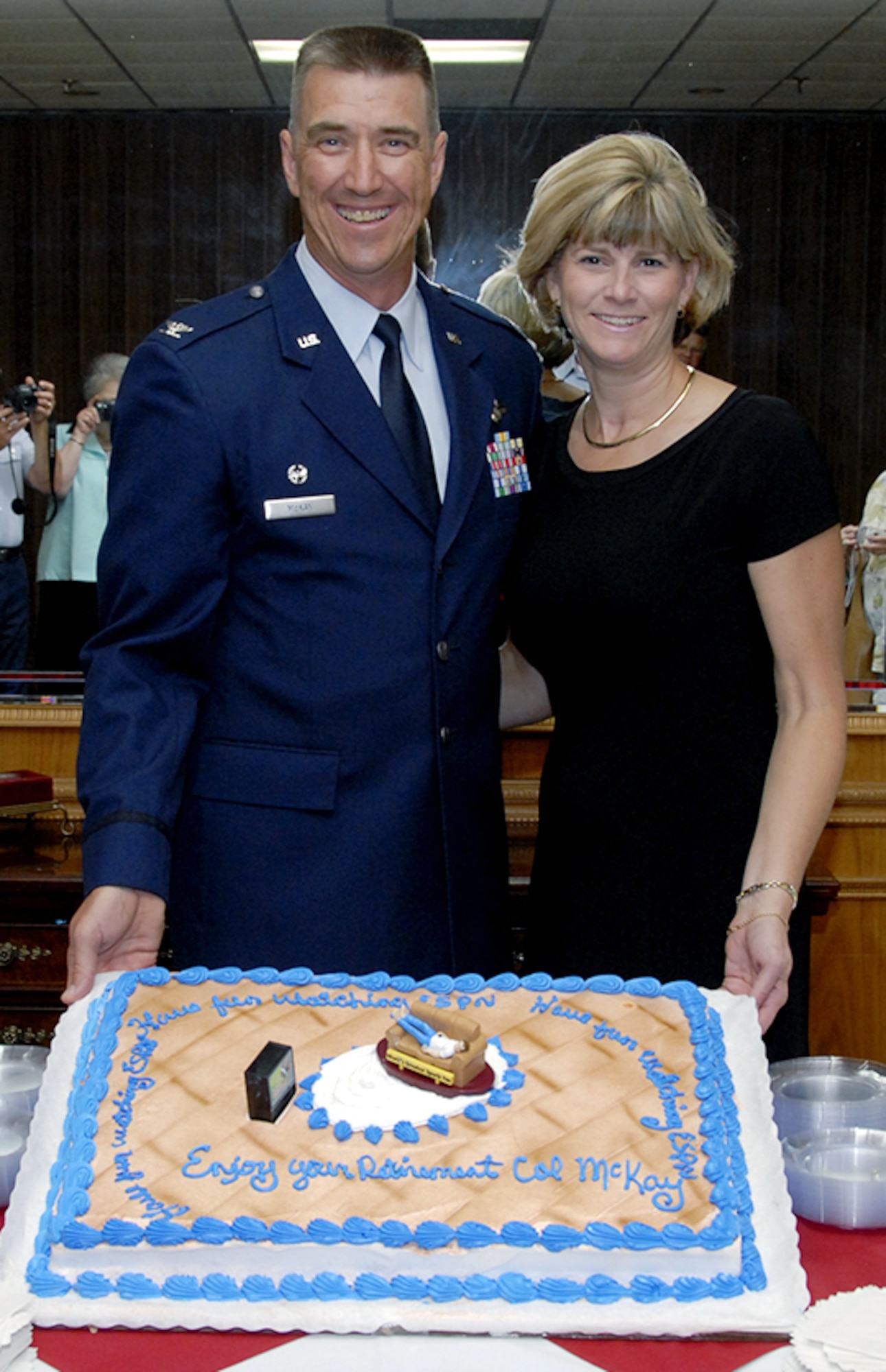 Former 82nd Mission Support Group Commander Col. Steven McKay and wife Lydia show off the cake prepared for the colonel's retirement party at the Sheppard Club Aug. 3.  Colonel McKay will reside in Virginia, where Lydia will attend medical school. (U.S. Air Force photo/Sandy Wassenmiller