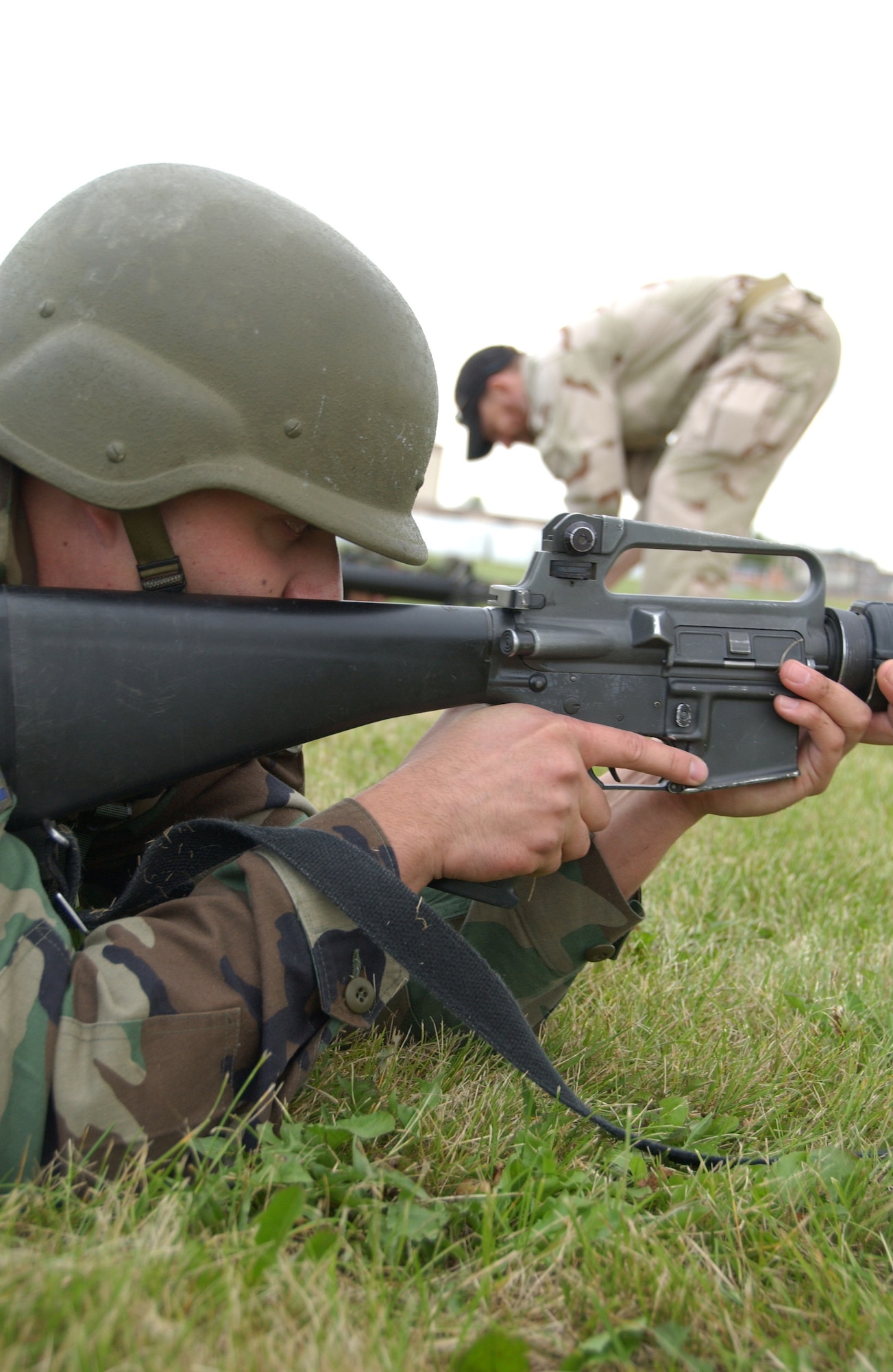 EIELSON AIR FORCE BASE, Alaska -- Airman 1st Class Aaron Diaz aims M-16 from the prone position as a part of combat skill training August 3, 2007. This training allows airmen to learn the skills necessary to perform and adapt in a combat environment while deployed to an overseas location.  (U.S. Air Force photo by Airman 1st Class Christopher Griffin)