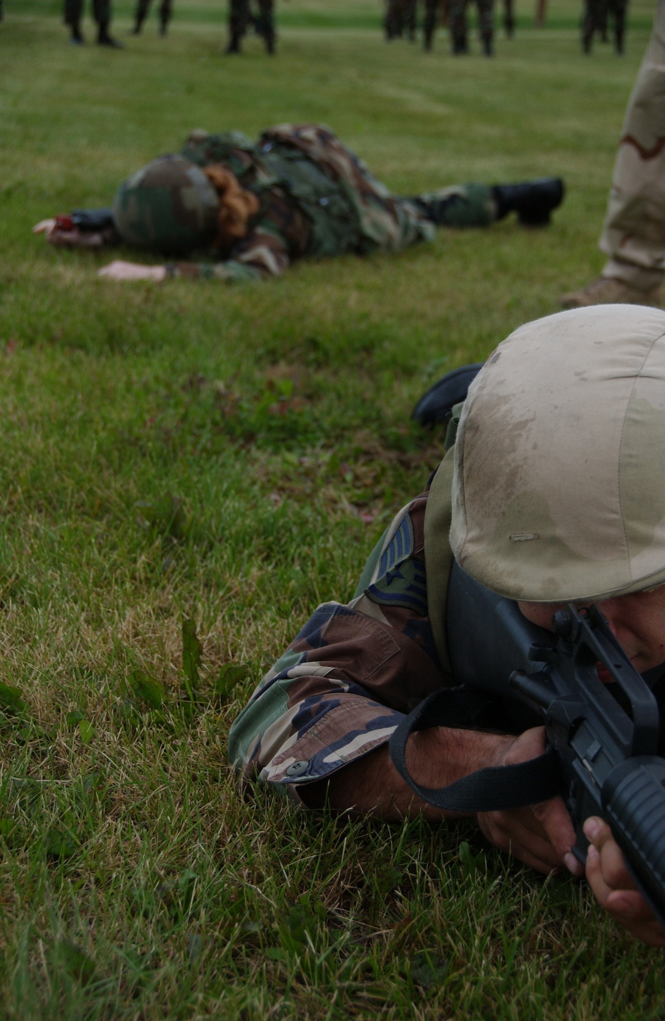 EIELSON AIR FORCE BASE, Alaska -- Airmen practice low crawling as a part of combat skill training August 3, 2007. This training allows airmen the necessary skills to perform and adapt in a combat environment while deployed to an overseas location.  (U.S. Air Force photo by Airman 1st Class Christopher Griffin)