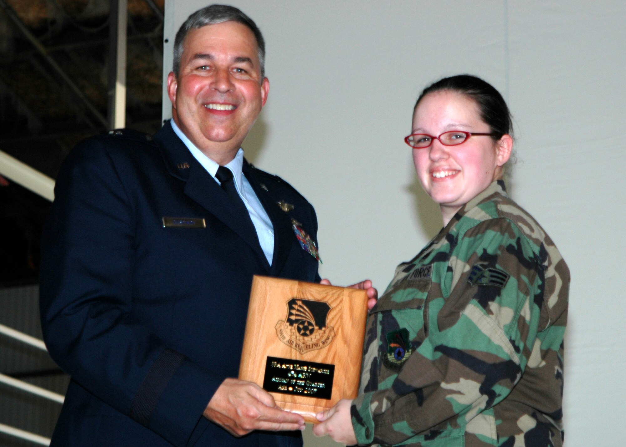 GRISSOM AIR RESERVE BASE, Ind., -- Brig. Gen. Dean Despinoy, 434th Air Refueling Wing commander, left, presents Senior Airman Anne Schwartze, 434th Logistics Readiness Squadron, a plaque recognizing her as the wing's Airman of the Quarter. (U.S. Air Force photo/Tech. Sgt. Doug Hays)