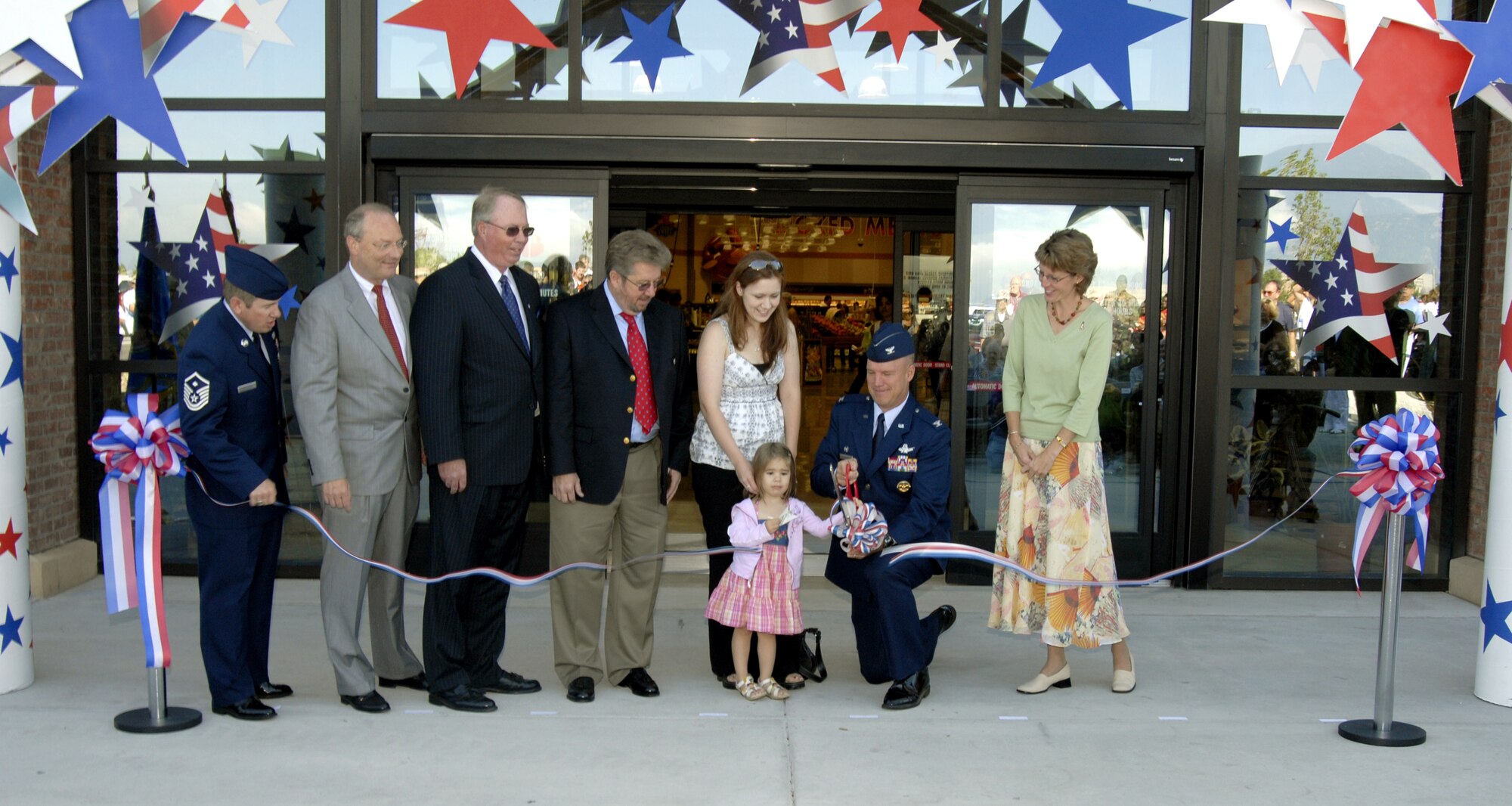 Following the ribbon cutting ceremony, thousands of shoppers crowded the new commissary to take advantage of huge savings. The new commissary has about 52,000 square feet of retail space, nearly twice the size of the old commissary.
Pictured are (left to right) Master Sgt. Drew Holland, Mr. Scott Simpson, Mr. Patrick Nixon, Mr. Bobby Mings, Mrs. Yvonne Martinez, Ms. Maklea Martinez, Col. Jay Raymond and Mrs. Mollie Raymond.
(U.S. Air Force photo by Roberta McDonald)