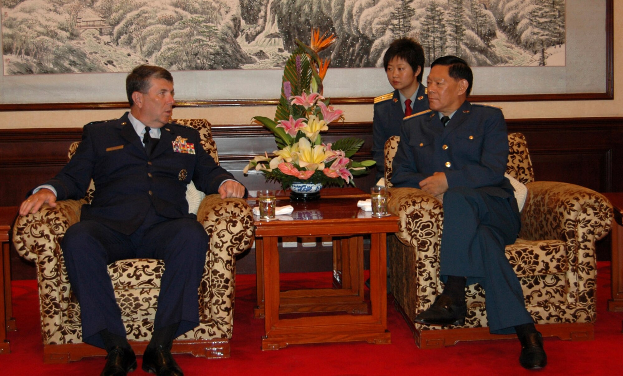 Gen. Paul V. Hester discusses military-to-military engagement with Chinese Gen. Ge Zhenfeng July 24 at the August 1st Building of the General Staff Command in Beijing. General Hester is the commander of Pacific Air Forces, and General Zhenfeng is the deputy chief of the General Staff Command, People's Liberation Army. Maj. Yao Rong of the People's Liberation Army Air Force provides interpretation. (U.S. Air Force photo/Maj. Ray Truong) 
