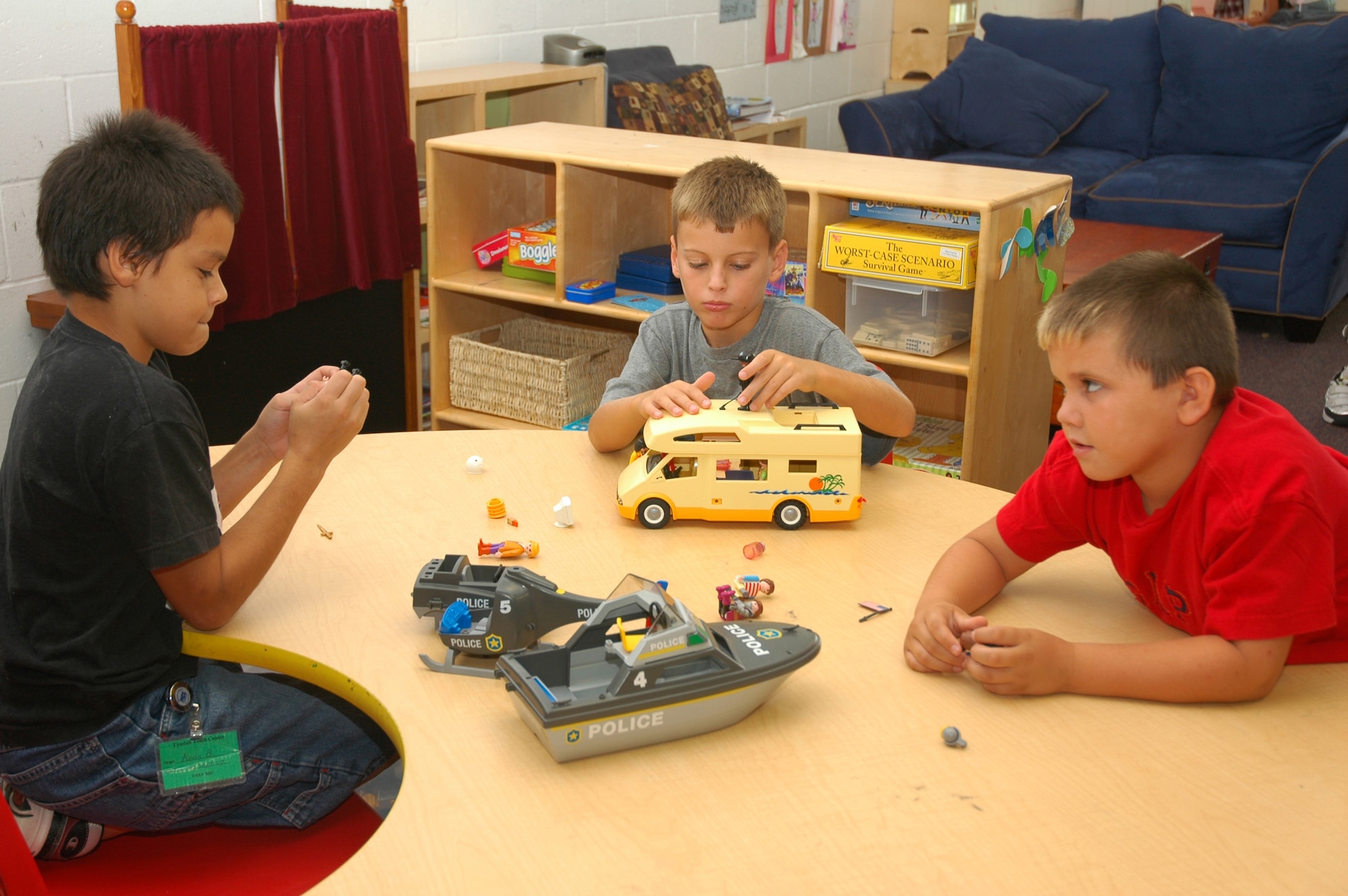 Kevin Brockie, Callaway Elementary School student, enjoys imaginary play with Erik Otano and Chase Hale, Tyndall Elementary school students, at the Youth Center's summer program.  Classrooms at the Youth Center are named according to the activities provided such as Computer Lab, Theatre Arts and Discovery.   (U.S. Air Force photo by Staff Sgt. Vesta Anderson)