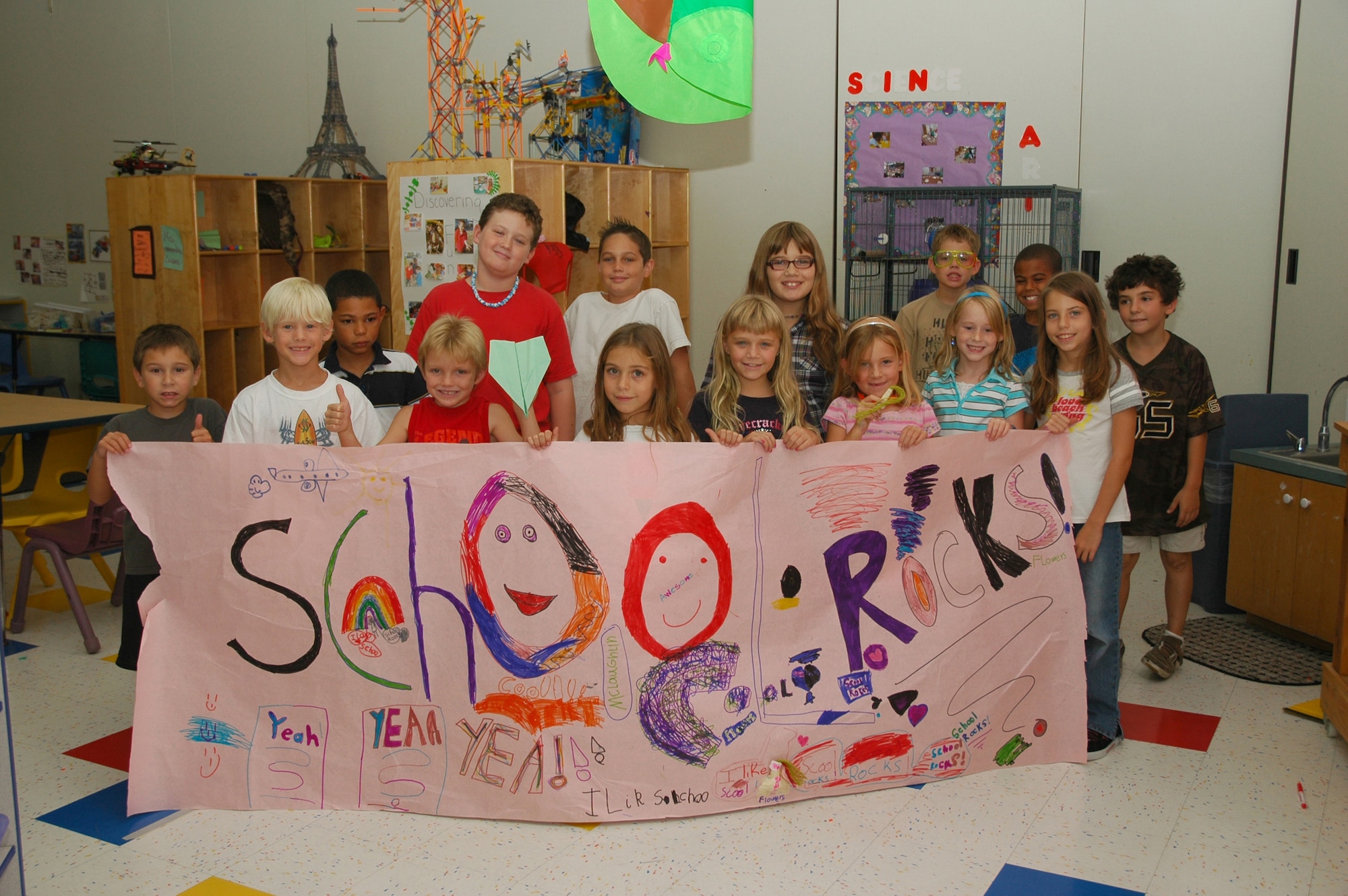 Children attending the Youth Center's summer program cheer for the start of school.  The center offers full-time care when school is not in session. During the school year, before and after-school care with bus transportation provided to and from Tyndall Elementary School is available. (U.S. Air Force photo by Staff Sgt. Vesta Anderson)