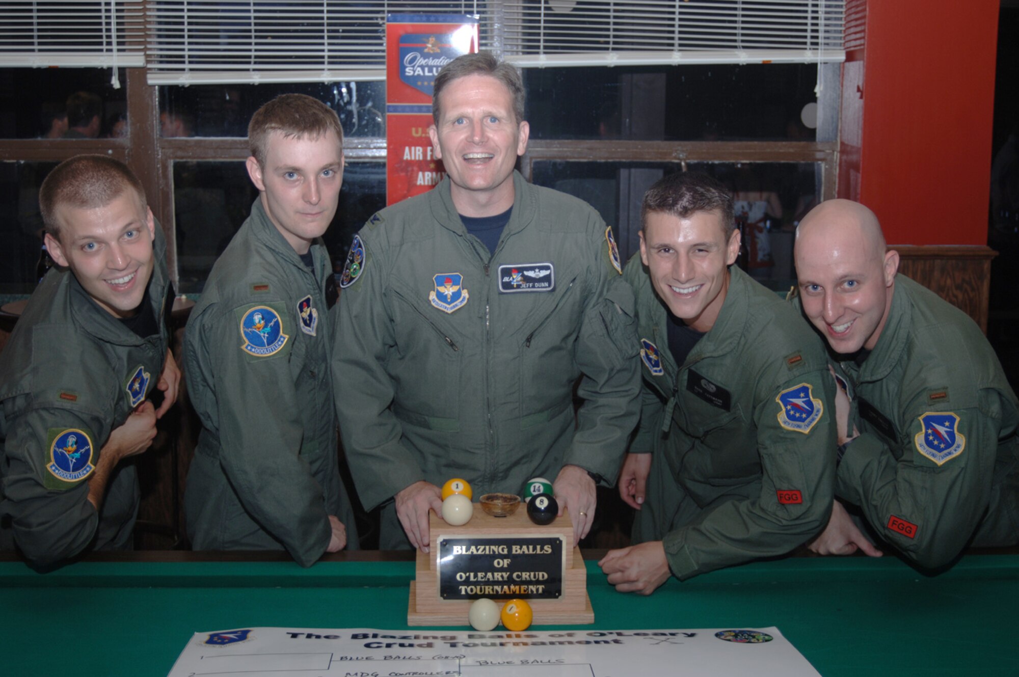 Four members of Specialized Undergradute Pilot Training Class 08-10 took home the Blazing Balls of O'Leary trophy at the SUPT 07-13 Assignment Night and Crud Tournament Friday. Members of the team include 2nd Lt. Mark Fattman, 2nd Lt. Casey Fallon, 2nd Lt. Mike Crew and 2nd Lt. Rich Smith. The winning team is seen here with Col. Jeff Dunn, 14th Flying Training Wing vice commander. (U.S. Air Force Photo by 2nd Lt. Daniel Bergen)