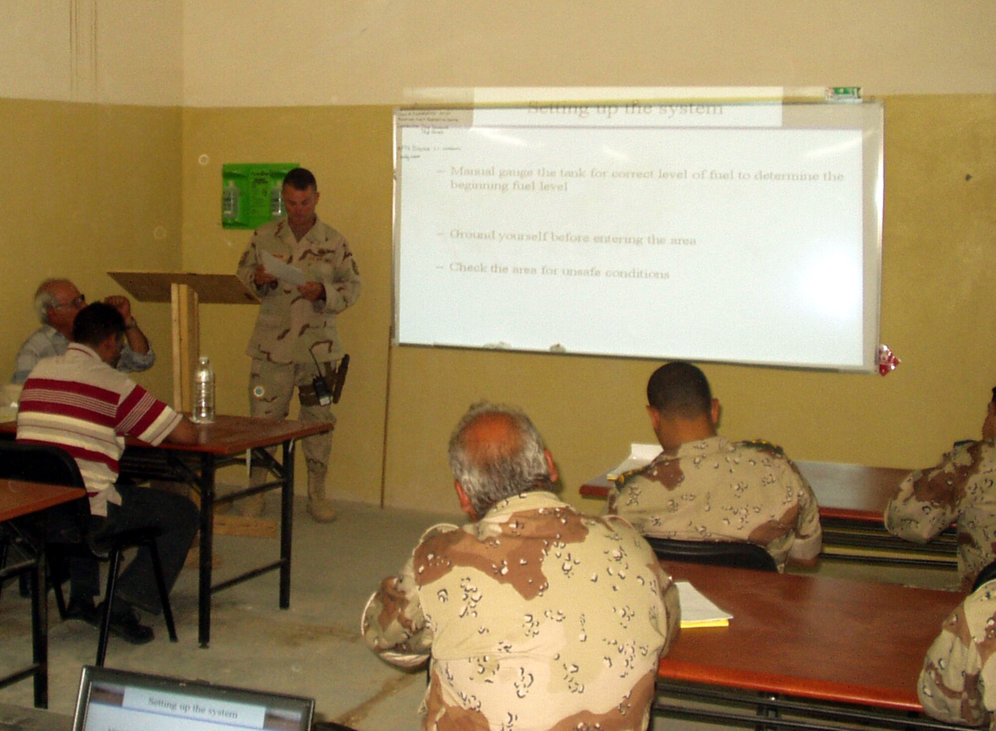 Tech Sgt. Randy Davidson, a deployed instructor with the 366th Training Squadron Fues Flight, instructs the first class of Iraqi fuels students. (U.S. Air Force photo)
