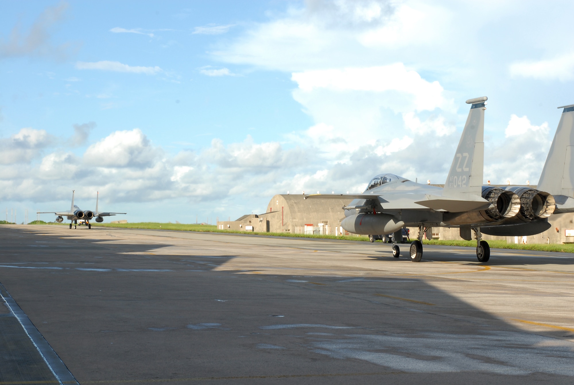 Two F-15C Eagles at Kadena Air Base, Japan, taxi for takeoff en route to Guam in support of Exercise Valiant Shield Aug. 5, 2007.  More than 400 base Airmen and F-15Cs, KC-135R Stratotankers and E-3 Airborne Warning and Control System aircraft are participating in the weeklong Pacific Command joint exercise which focuses on integrated joint training to enable real-world proficiency in sustaining forces and detecting, locating, tracking and engaging units at sea, in the air, on land, and cyberspace in response to a range of mission areas. Lieutenant Fischer is a 44th Fighter Squadron pilot. USAF photo/Airman 1st Class Kelly Timney