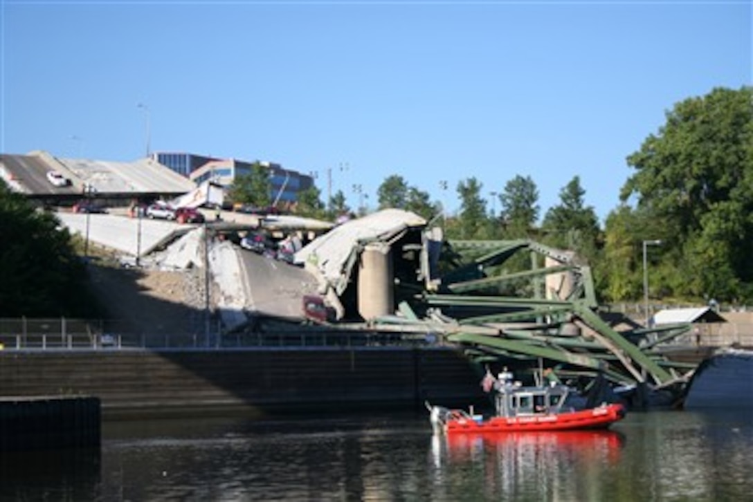 A 25-foot Coast Guard small boat from Sector Upper Mississippi River patrols a safety zone around the Minnesota bridge collapse site in Minneapolis, Minn., on Aug. 3, 2007.  The Coast Guard is enforcing a seven-mile closure of the Mississippi River to support local efforts to search for victims and remove debris from the waterway.  