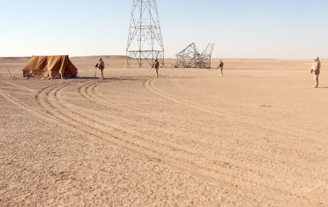 COMBAT OUTPOST RAWAH, IRAQ – Master Sgt. Jerri A. Schlickenmayer, the tank leader for Company B, 1st Tank Battalion, supporting Task Force Highlander, Regimental Combat Team 2, leads a group of Marines to search a Bedouin (nomad) tent in the Al Anbar province. The tanks spent nearly a week combing the Iraqi desert in support of Operation Punisher III. Official Marine Corps Photo By Cpl. Ryan C. Heiser.
