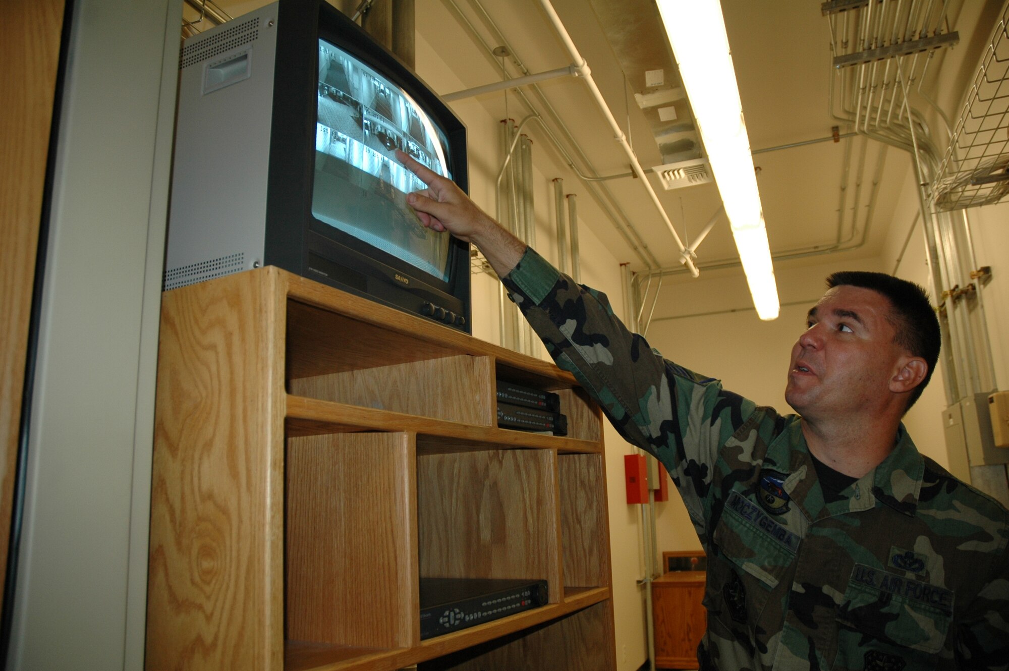 Master Sgt. Albert Moczygemba, 341st Civil Engineer Squadron dorm manager, reviews tapes from cameras positioned throughout a dormitory. Dorm management positions are open at Malmstrom and individuals are needed to step up to take on this challenging and rewarding position. (U.S. Air Force photo / Airman 1st Class Emerald Ralston)
