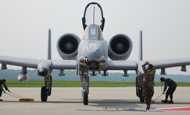 Maintainers with the 23rd Maintenance Group place the chocks under Moody Air Force Base’s first A-10C Thunderbolt II Aug. 7. This aircraft is the first of approximately 50 upgraded A-10Cs moving to the base as a part of a force realignment. The move is expected to be complete in early spring 2008. (U.S. Air Force photo by Tech. Sgt. Parker Gyokeres)