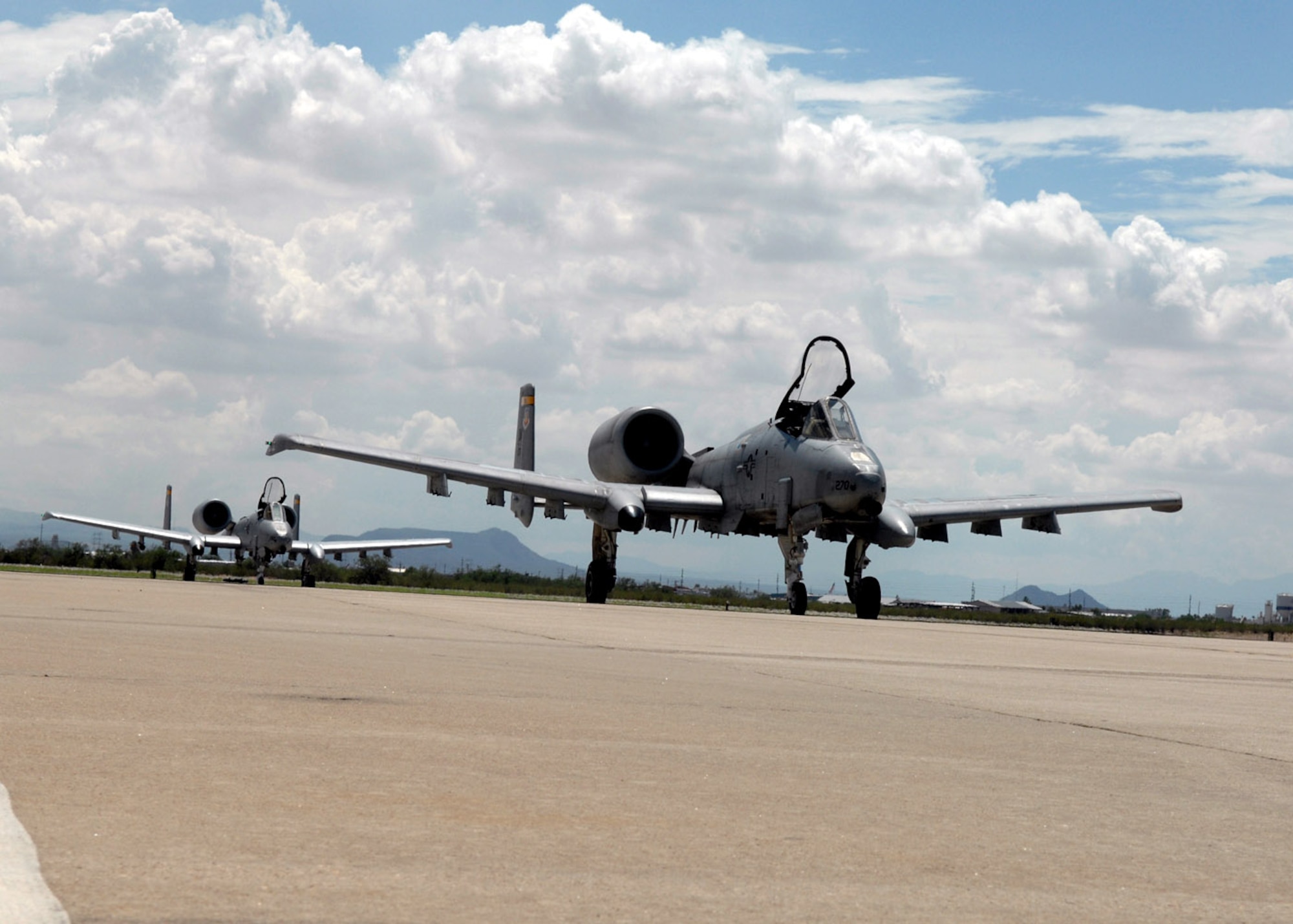 Second Lieutenant Aaron Cavazos taxis an A-10 Thunderbolt II after completing the first A-10C pilot initial qualification course Aug. 2 at Davis-Monthan Air Force Base, Ariz. During the seven-month-long qualification course, the training focused on the new A-10C platform which replaced the A-10A. The pilots also learned the basics of being attack pilot wingmen, which included flying in formation to provide mutual support, communicate with radios and kill the assigned target on the first attempt. Lieutenant Cavazos is assigned to the 357th Fighter Squadron. (U.S. Air Force photo/Senior Airman Christina D. Ponte)