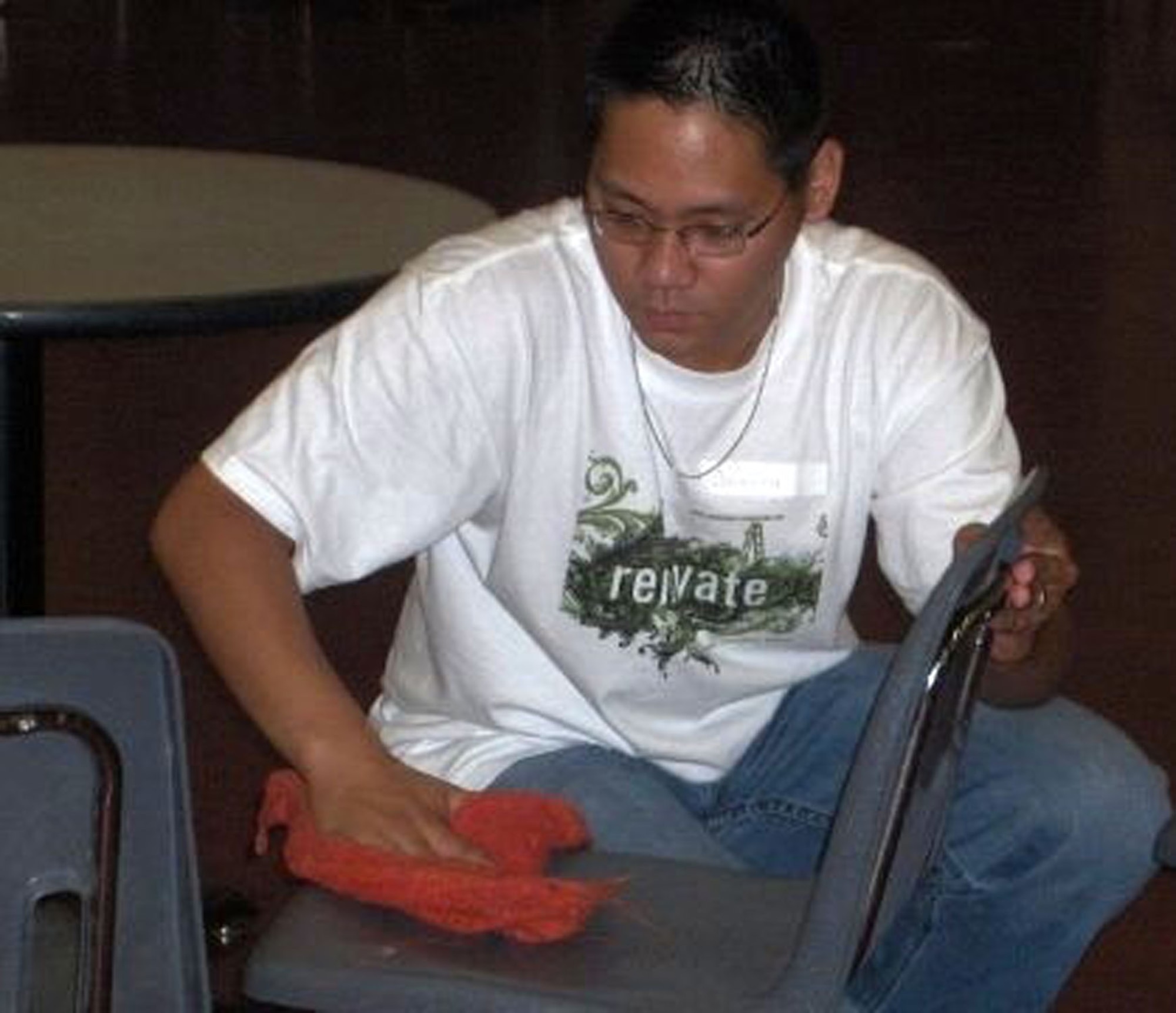 Senior Airman Joseph Devera cleans a chair at a homeless shelter in Minneapolis, Minn., during a "Week of Hope" July 7 to 14. The program is a mission trip for junior and senior high school students to provide help to needy people. Airman Devera was a leader in a "crew" of five people comprised of volunteer high school students from the Catholic and Protestant parishes at Malmstrom Air Force Base. The 20 volunteers from Malmstrom clocked 560 hours at 25 seperate worksites in the Twin Cities. The youth group plans to go to either Peru or Puerto Rico next year. (U.S. Air Force photo).