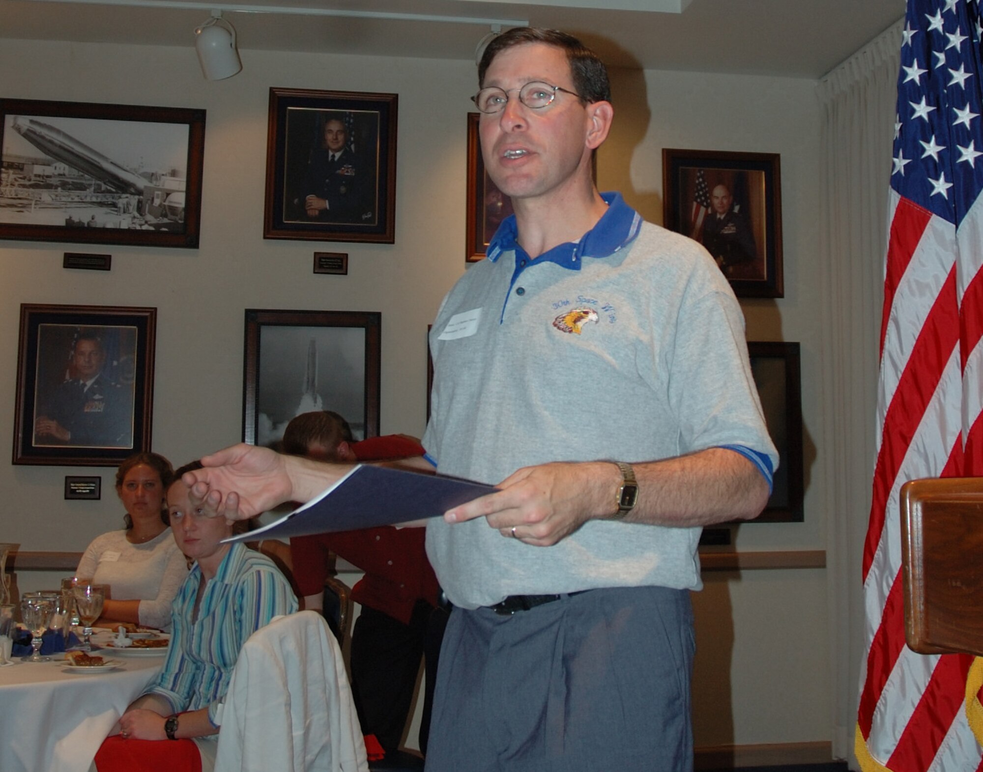 VANDENBERG AIR FORCE BASE, Calif. -- During the Birds and Bars Dinner, 30th Space Wing Commander Col. Steve Tanous speaks with junior officers about the values of mentorship in the Pacific Coast Club Warrior Room on July 31.  The dinner gave lieutenants and captains the chance to gain leadership perspective from base commanders. (U.S. Air Force photo/2nd Lt. Raymond Geoffroy)