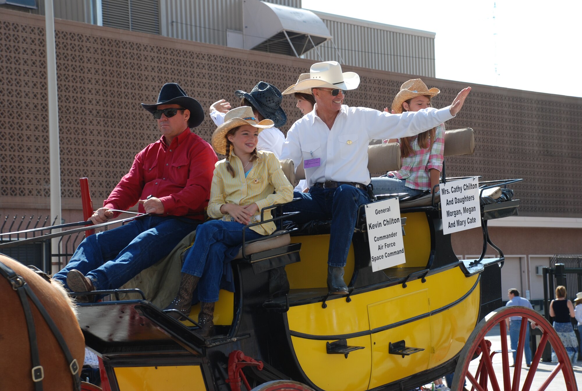 Gen. Kevin P. Chilton, Air Force Space Command commander, and family participate in Cheyenne Frontier Days parade July 28. This was last of four parades that took place during CFD (Photo by Airman 1st Class Daryl Knee).