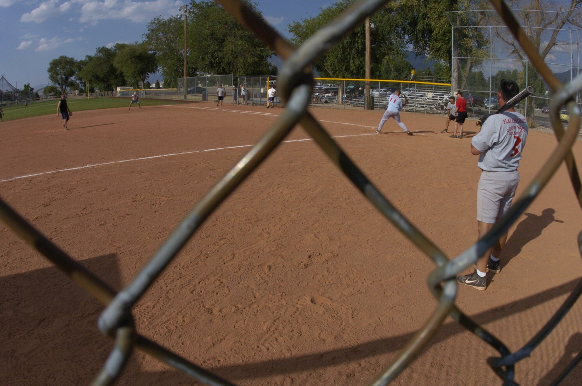 A member of the Civil Engineer Softball Team takes a swing during the Aug. 6, Hill Air Force Base Intramural Competition League Championship Game against Ammo. The CE Team, which advanced from the loser's bracket, won the first game 14-11.  The Ammo Team won the second game 26-24 securing the championship for Ammo. Members of the Ammo Team are looking forward to competing in a Layton, Utah, Community League in the fall. (Photo by Airman 1st Class Clay Murray)