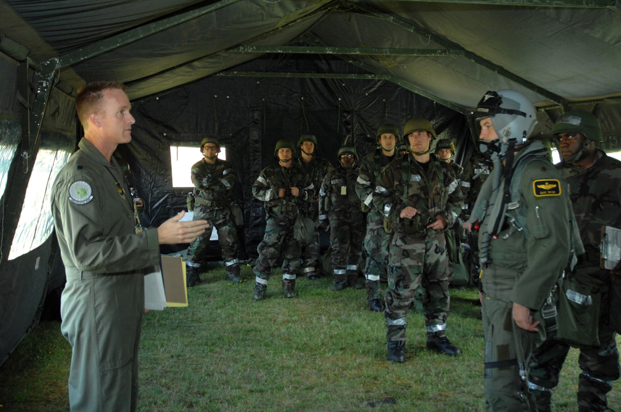 Lieutenant Colonel Doug Jenkins of Wing Inspections, Exercises and Readiness briefs 48th Fighter Wing Airmen during an Operations Evaluation July 31. In this simulation, the squadron operations center was damaged by mortar fire. (U.S. Air Force photo by Airman First Class John Easterling)
