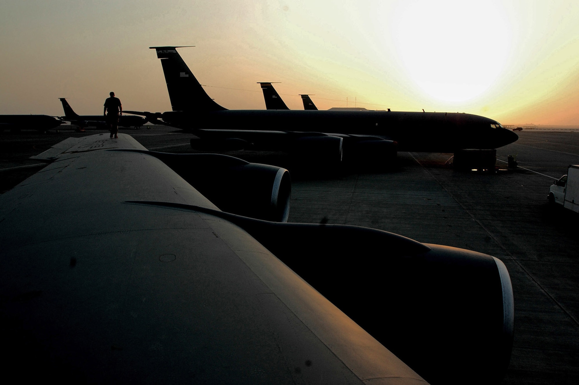 Staff Sgt. Wesley Hughston inspects the wing of a KC-135 Stratotanker parked on the ramp of a deployed location in Southwest Asia. Sergeant Hughston is a crew chief with the 379th Expeditionary Aircraft Maintenance Squadron.  (U.S. Air Force photo/Senior Airman Clark Staehle)