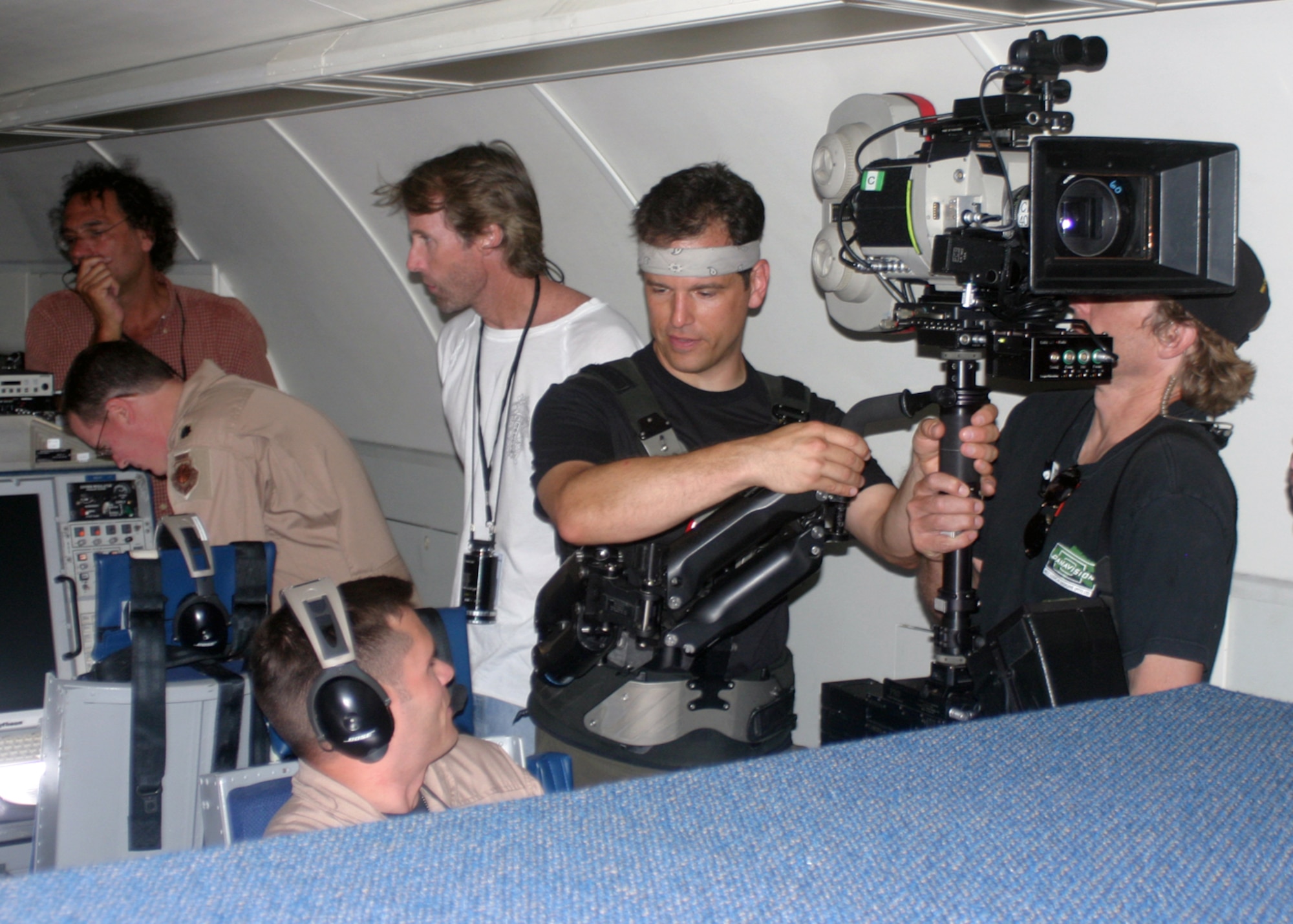 The "Transformers: The Movie" film crew sets up their camera right next to 1st Lt. Jason White, 965th Airborne Air Control Squadron, inside an E-3 Sentry in preparation for shooting a scene for the movie.  Creators of the "Transformers" movie invited members of the 965th AACS to Edwards Air Force Base, Calif., in September 2006 to shoot realistic military footage that was used in the movie.  (Photo by Capt. Corinna Jones)