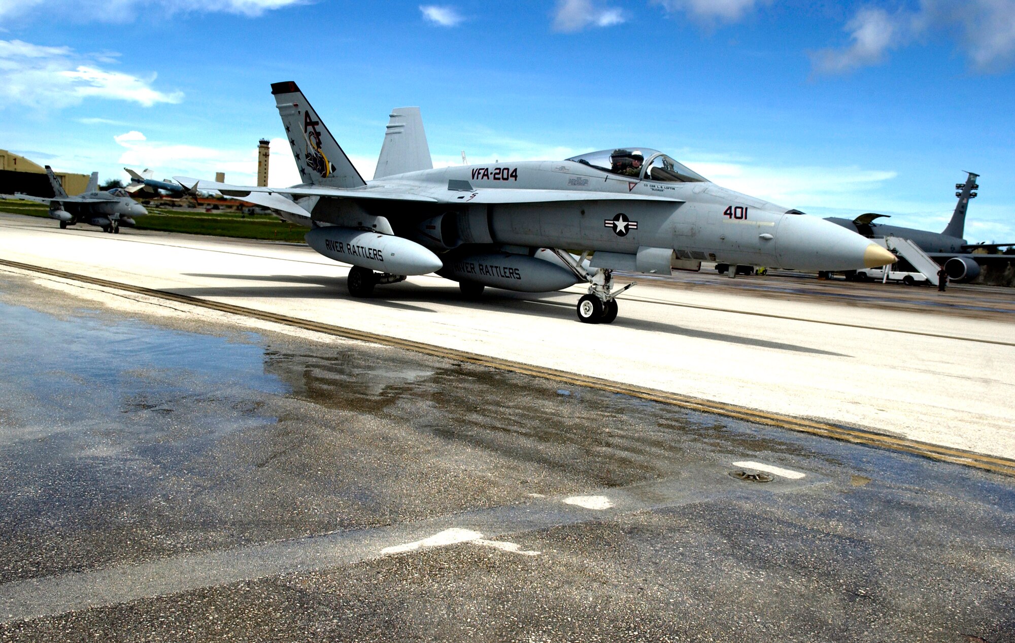 Navy F-18 Hornets from the Naval Air Station's Joint Reserve Base in New Orleans arrive to take part in the Valiant Shield exercise Aug. 6 at Andersen Air Force Base, Guam. During the exercise being held Aug. 6 to 13, Airmen will participate in integrated joint training with Navy and Coast Guard forces. Air Force aircraft and personnel from stateside bases and Kadena Air Base, Japan, will comprise part of an expeditionary air wing based at Andersen AFB. (U.S. Air Force photo/Senior Airman Miranda Moorer) 
