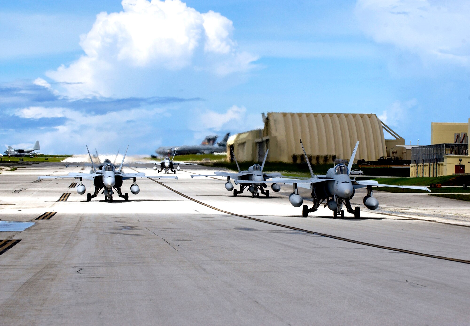 Navy F-18 Hornets from the Naval Air Station's Joint Reserve Base in New Orleans arrive to take part in the Valiant Shield exercise Aug. 6 at Andersen Air Force Base, Guam. During the exercise being held Aug. 6 to 13, Airmen will participate in integrated joint training with Navy and Coast Guard forces. Andersen AFB will also be the beddown location for approximately 64 Air Force and 29 Navy aircraft, plus transient aircraft, during Valiant Shield. (U.S. Air Force photo/Senior Airman Miranda Moorer) 
