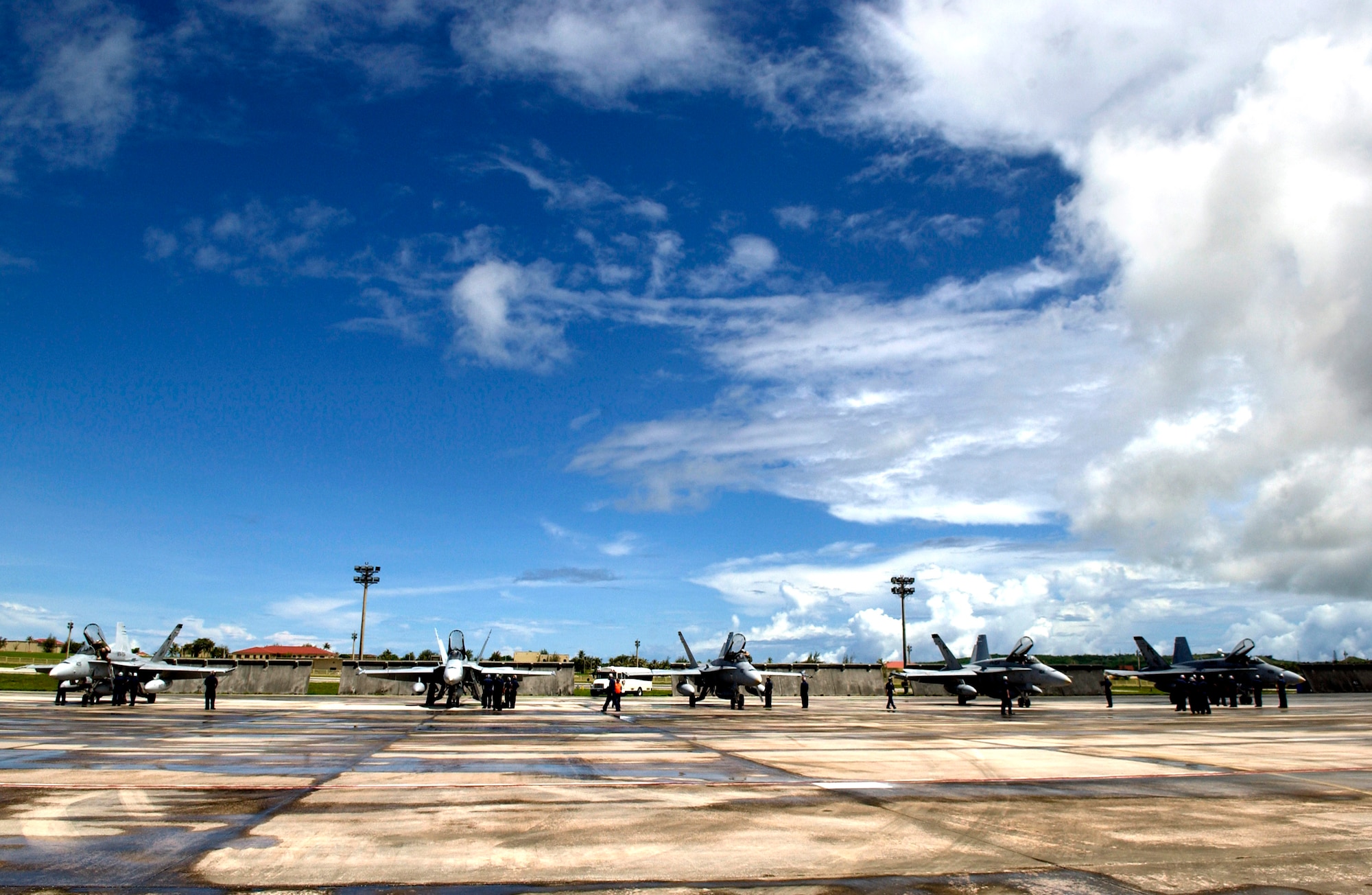 Navy F-18 Hornets from the Naval Air Station's Joint Reserve Base in New Orleans arrive to take part in the Valiant Shield exercise Aug. 6 at Andersen Air Force Base, Guam. During the exercise, Air Force aircraft and Airmen from stateside bases and Kadena Air Base, Japan, will comprise part of an expeditionary air wing based at Andersen AFB. These forces will participate in integrated joint training with Navy and Coast Guard forces. (U.S. Air Force photo/Senior Airman Miranda Moorer) 
