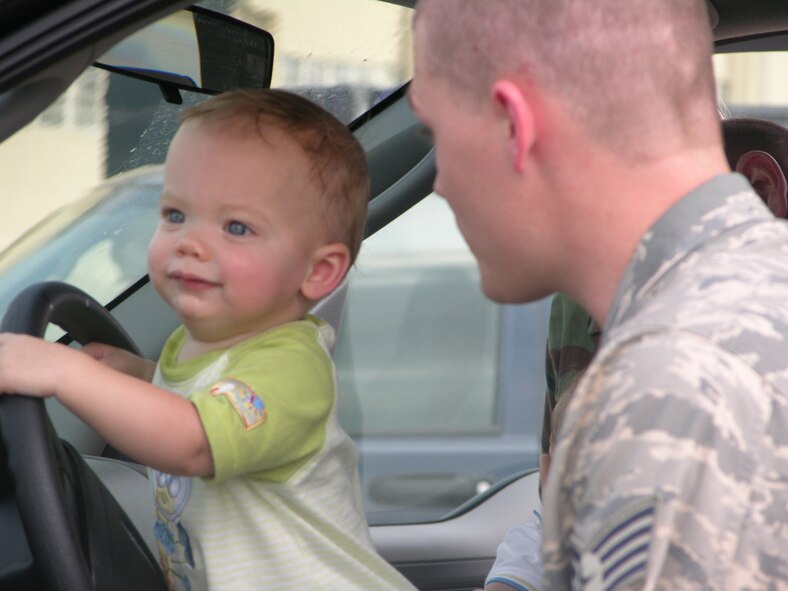 SEYMOUR JOHNSON AIR FORCE BASE, N.C. -- Staff Sgt. David Adams spends a few last minutes with his son before he deploys to Kirkuk, Iraq on Aug. 6. Sgt. Adams is one of nearly 40 security forces troops from the 916th Air Refueling Wing, Air Force Reserve, that was called to active duty in continued support of Operation Iraqi Freedom.