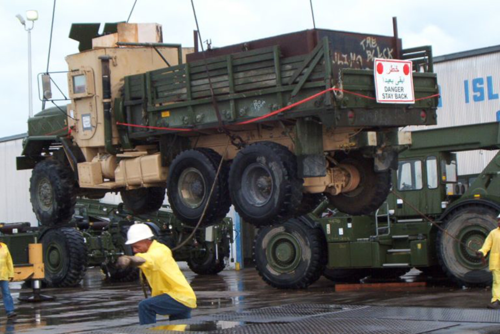 A longshoreman unloads the gun truck at the Port of Beaumont, Texas, April 21, 2006. The truck is now on exhibit at the Enlisted Heritage Hall at Maxwell Air Force Base's Gunther Annex, Ala. (Official U.S Air Force photo)(released)