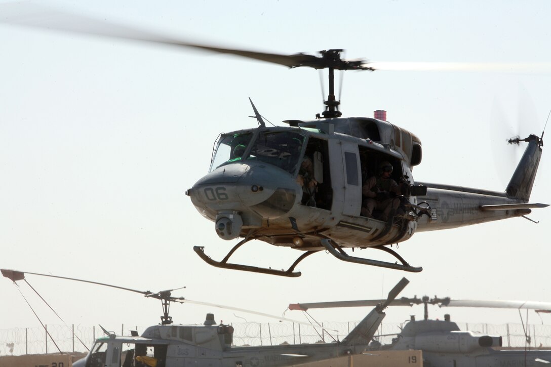 AL TAQADDUM, Iraq - A UH-1N "Huey" flown by Marine Light Attack Helicopter Squadron 369 returns to the flightline after completing a mission, Aug. 8.  The squadron's primary mission is providing close air support to Marines on the ground.