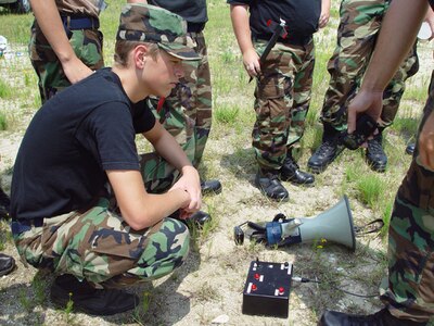 Cadet 2nd Lt. Keith Bartlett, 16, examines the rocket launch controls just before launch at a recent squadron model rocket exercise at an exchange club in Summerville, S.C.  (courtesy photo)                            